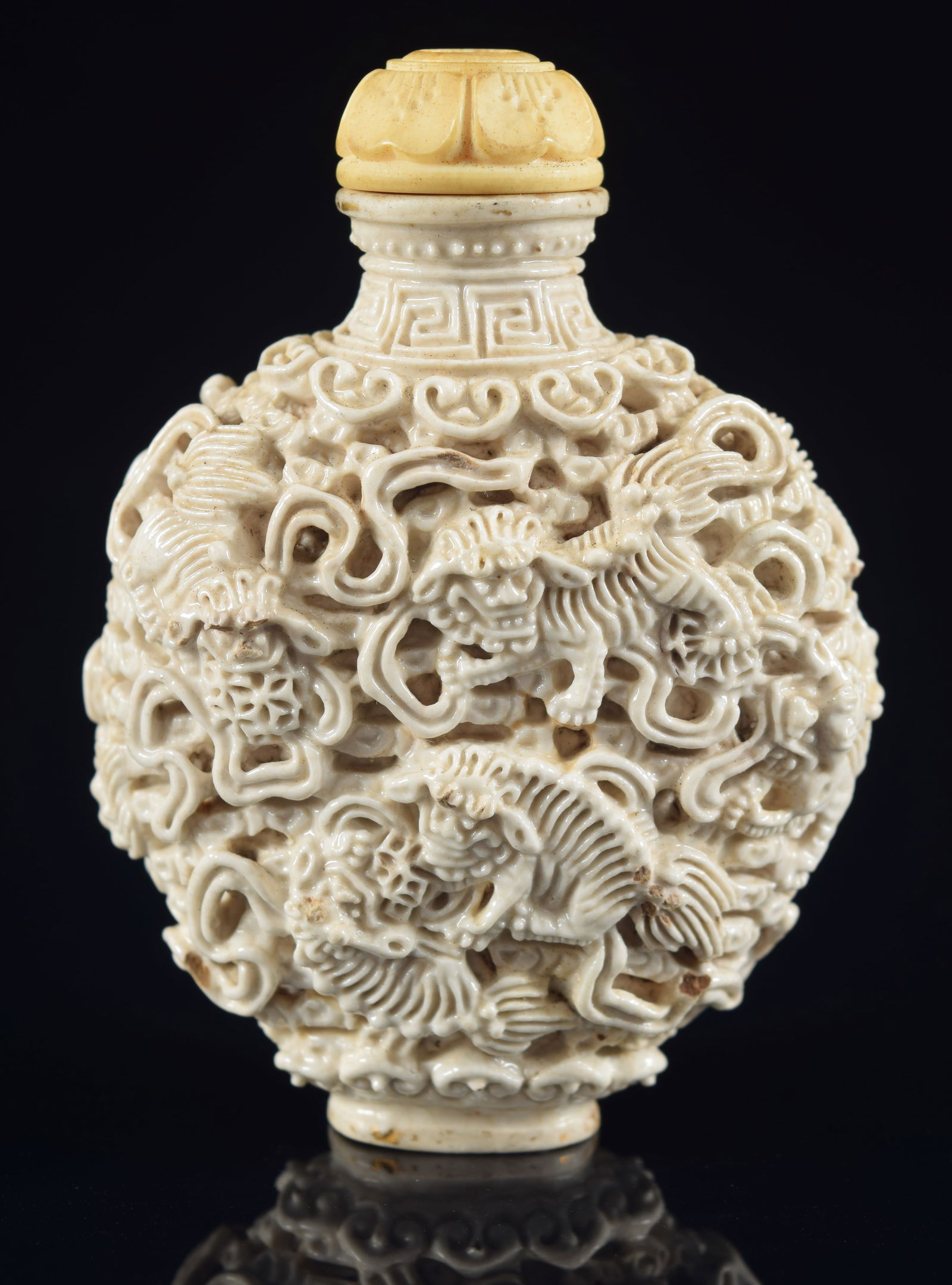 Porcelain snuff bottle. Chia Ching mark (1796-1820). Reticulated and carved with foo dogs and (1 of 6)