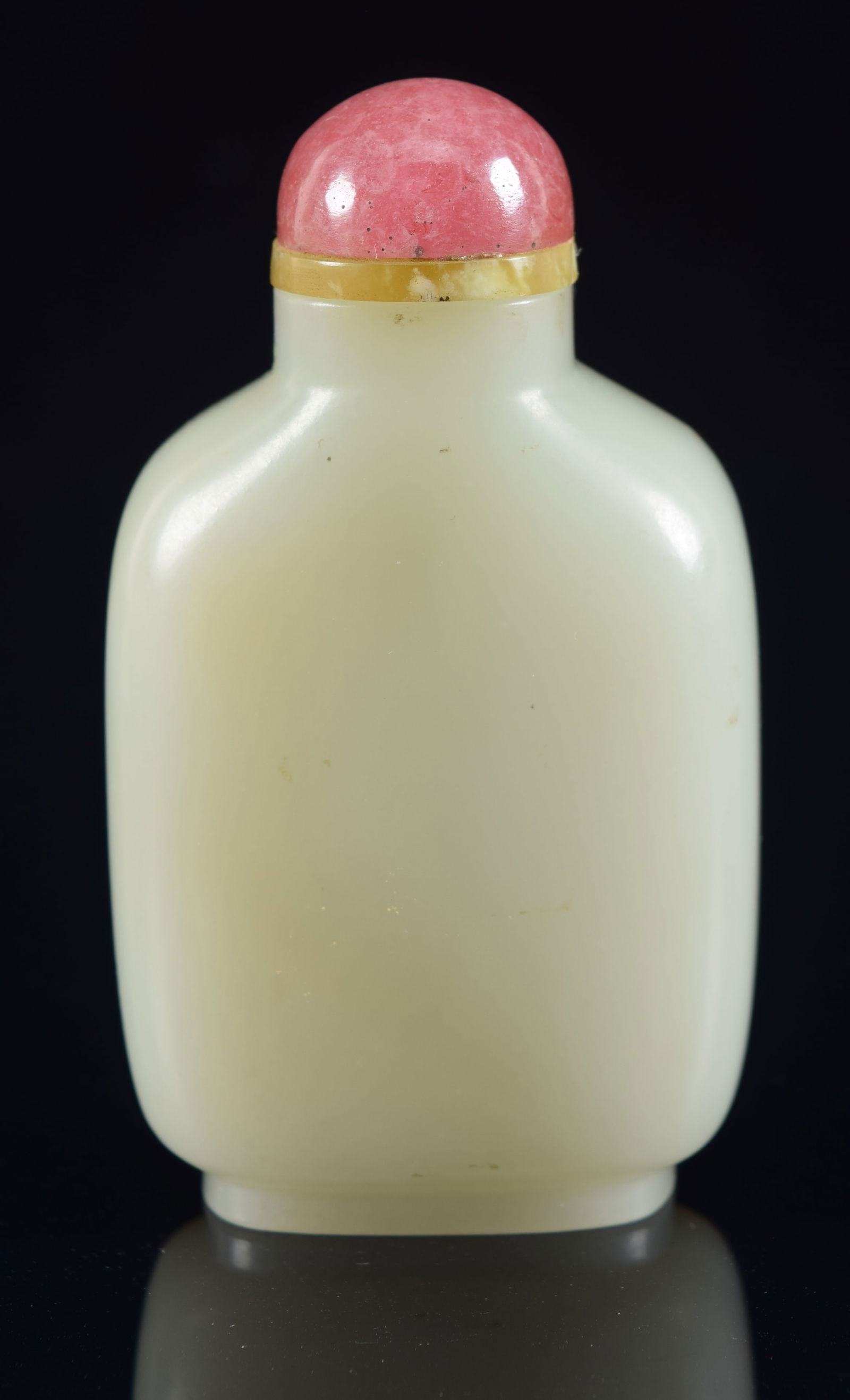 Nephrite snuff bottle. China. 19th century. Brown skin polished to one side. 2.75in H. Provenance: (1 of 5)