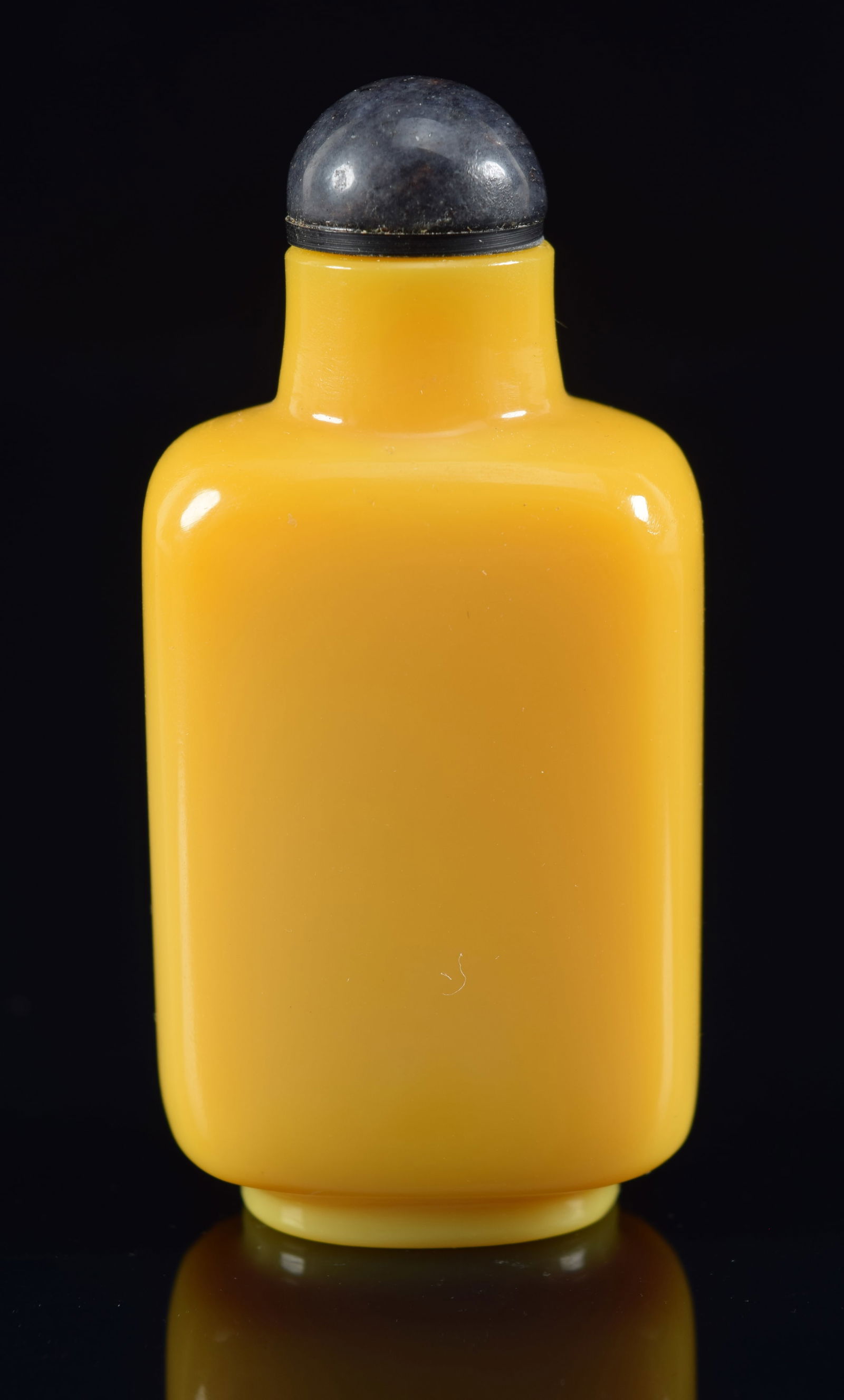 Imperial yellow glass snuff bottle. China. 19th century. Rectangular shape. 2.25in H. Provenance: (1 of 6)