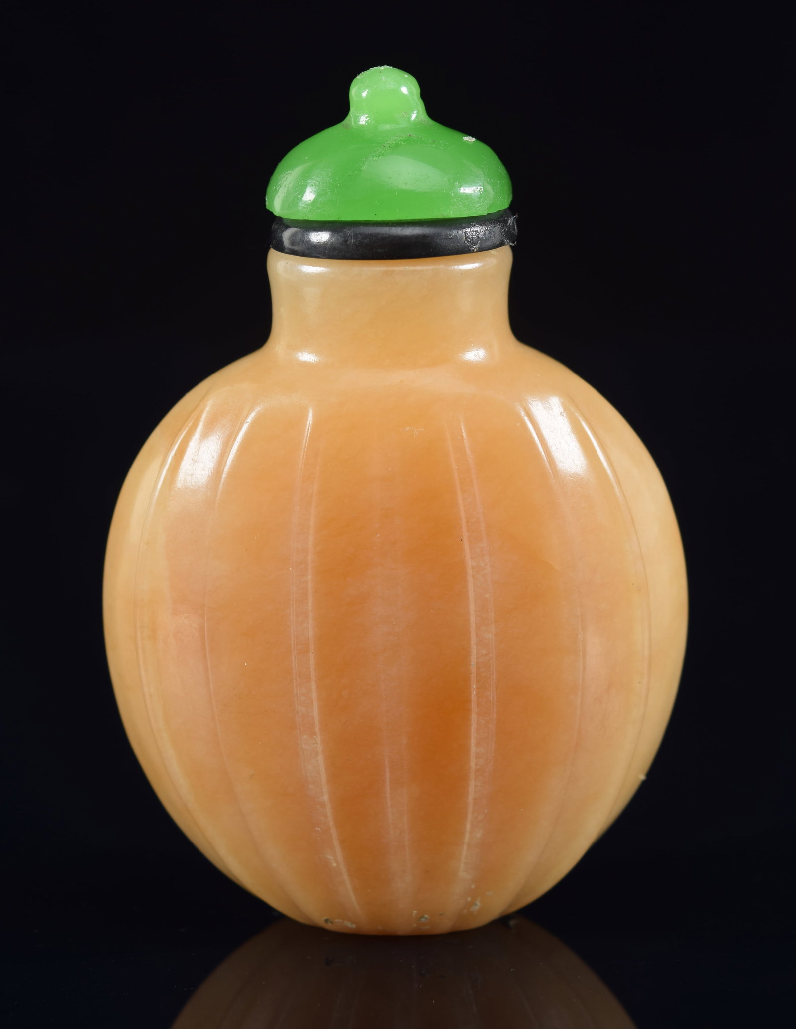 Jade snuff bottle. China. Tan colored. Ribbed body. Glass stopper. 2.25in H. Provenance: The: Jade snuff bottle. China. Tan colored. Ribbed body. Glass stopper. 2.25in H. Provenance: The Mitchell Bistany Collection.