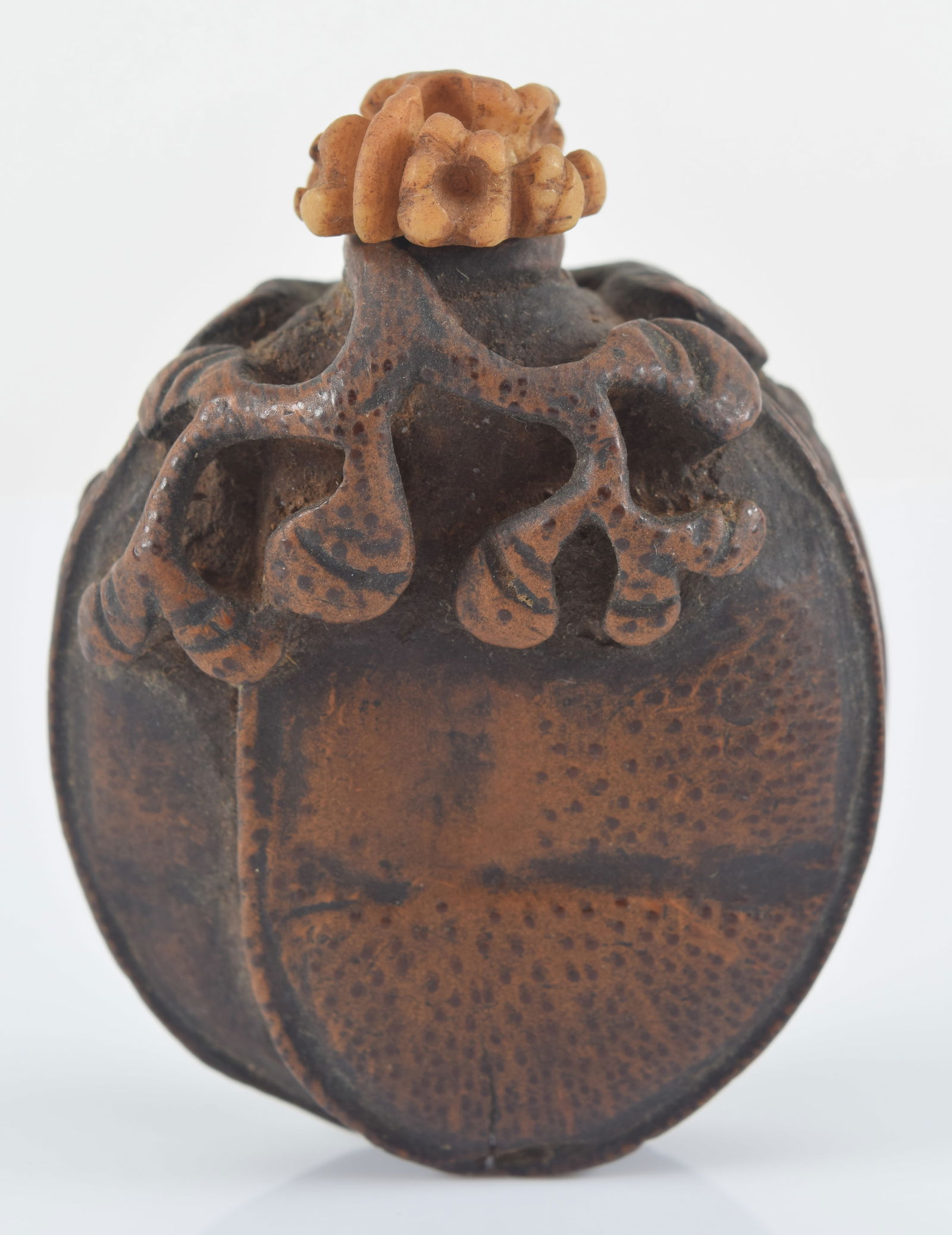 Carved bamboo snuff bottle. China. 19th century. Carved as a nut with foliage. 1.75in H. Provenance: (1 of 6)