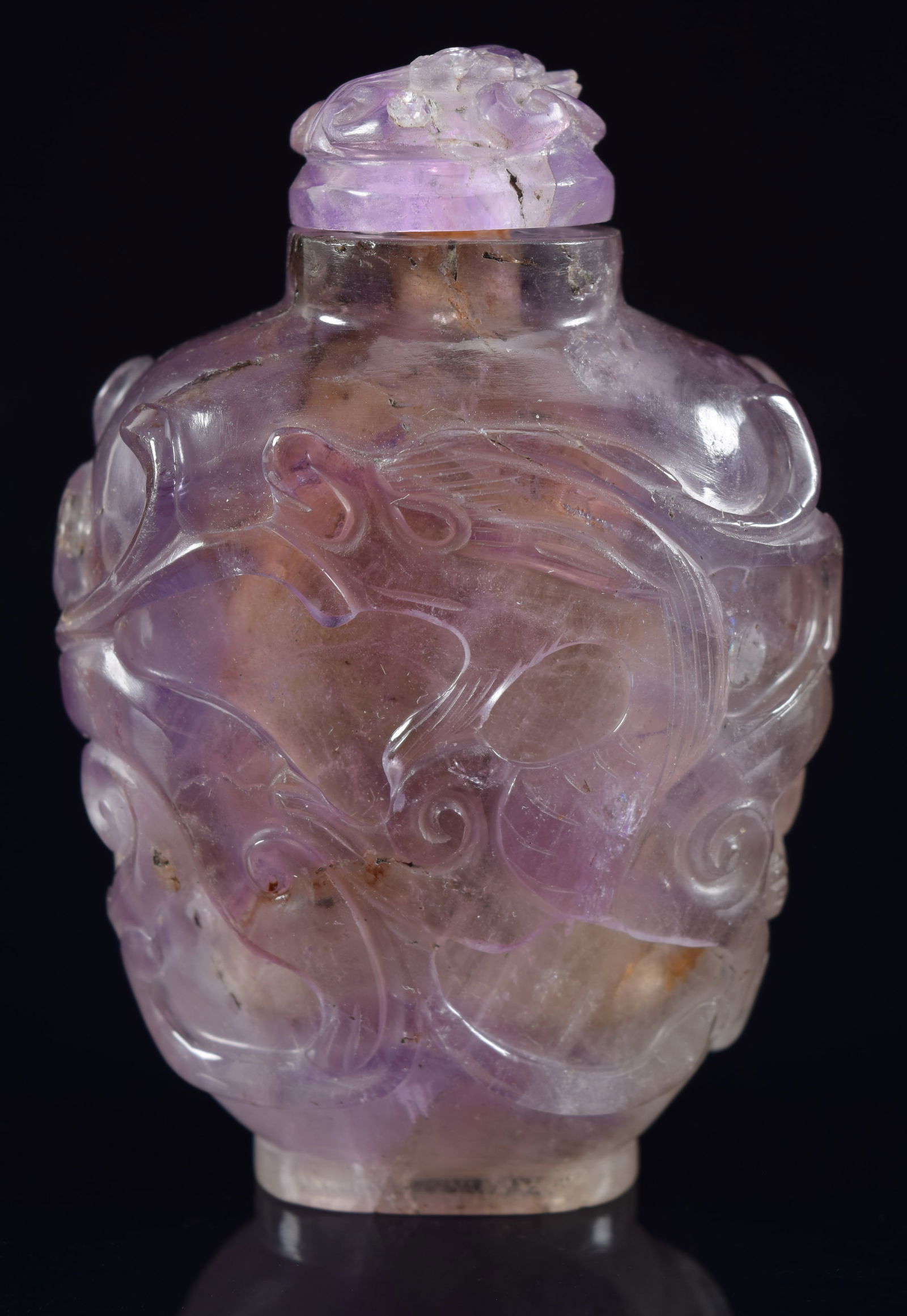 Amethyst snuff bottle. China. 19th century. Surface carved with chih lung. Matching stopper. 2.5in (1 of 6)