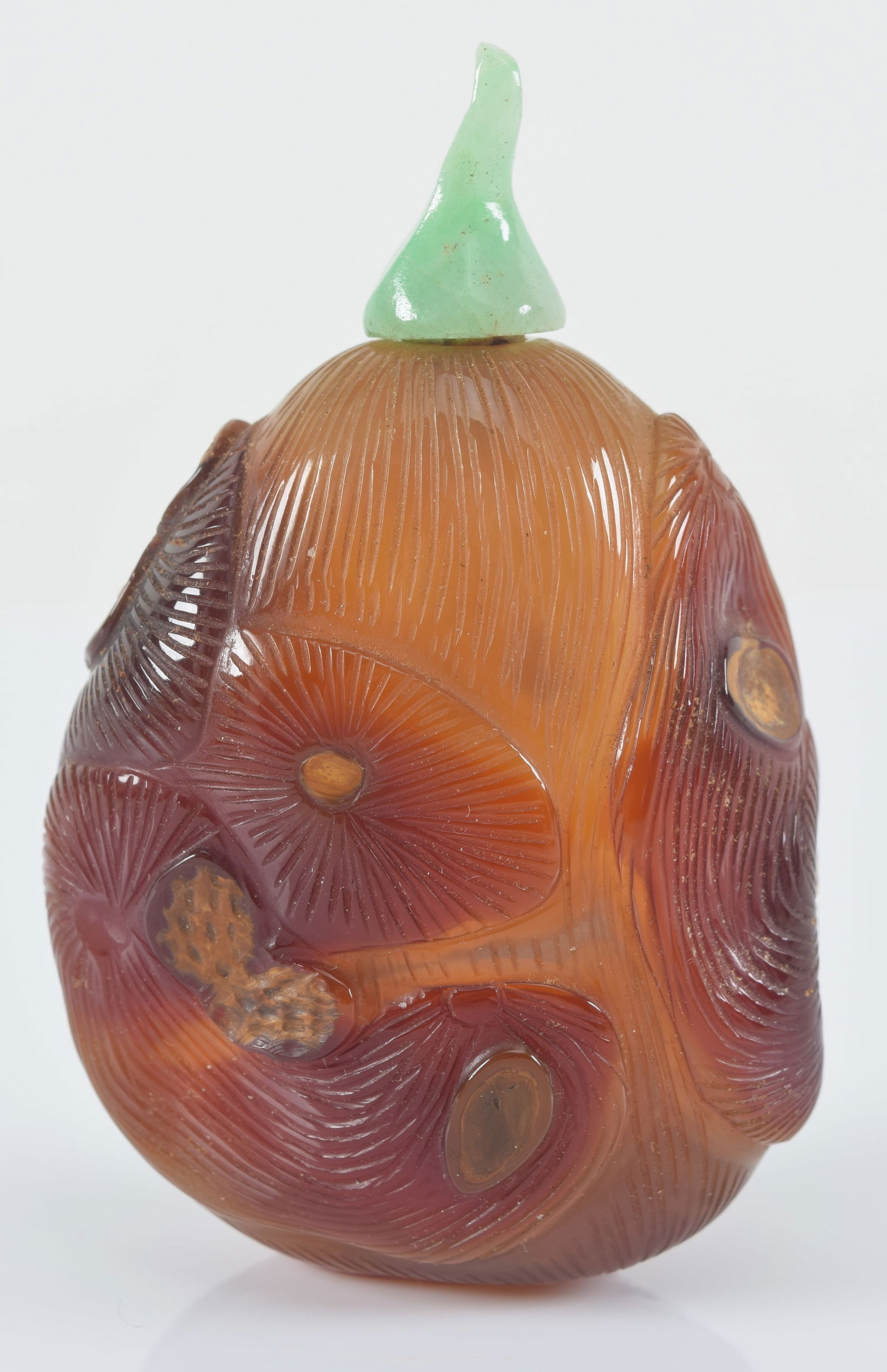 Agate snuff bottle. China. 19th century. Surface carved as a pod with peanuts. Jadeite stopper. (1 of 6)