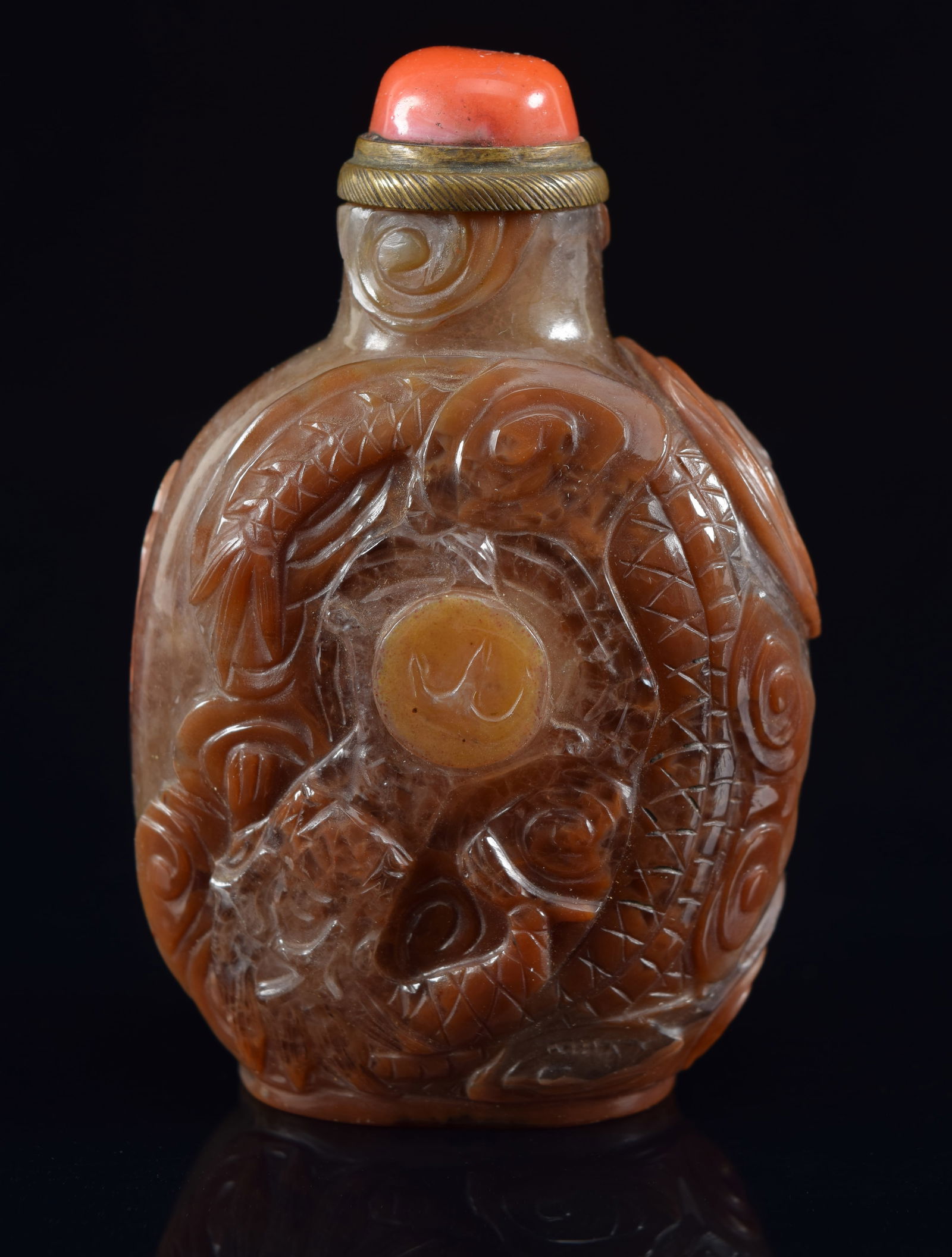 Agate snuff bottle. China. 19th century. Surface carved with dragons. Coral and brass stopper. (1 of 6)