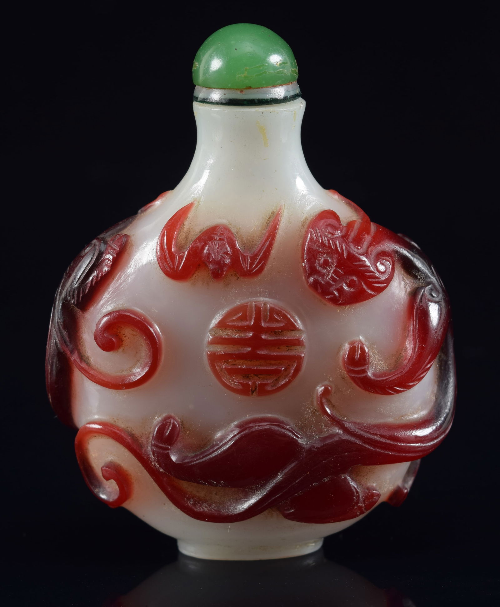 Cameo glass snuff bottle. China. 19th century. Red cut to white with chih lung, bats and shou (1 of 6)