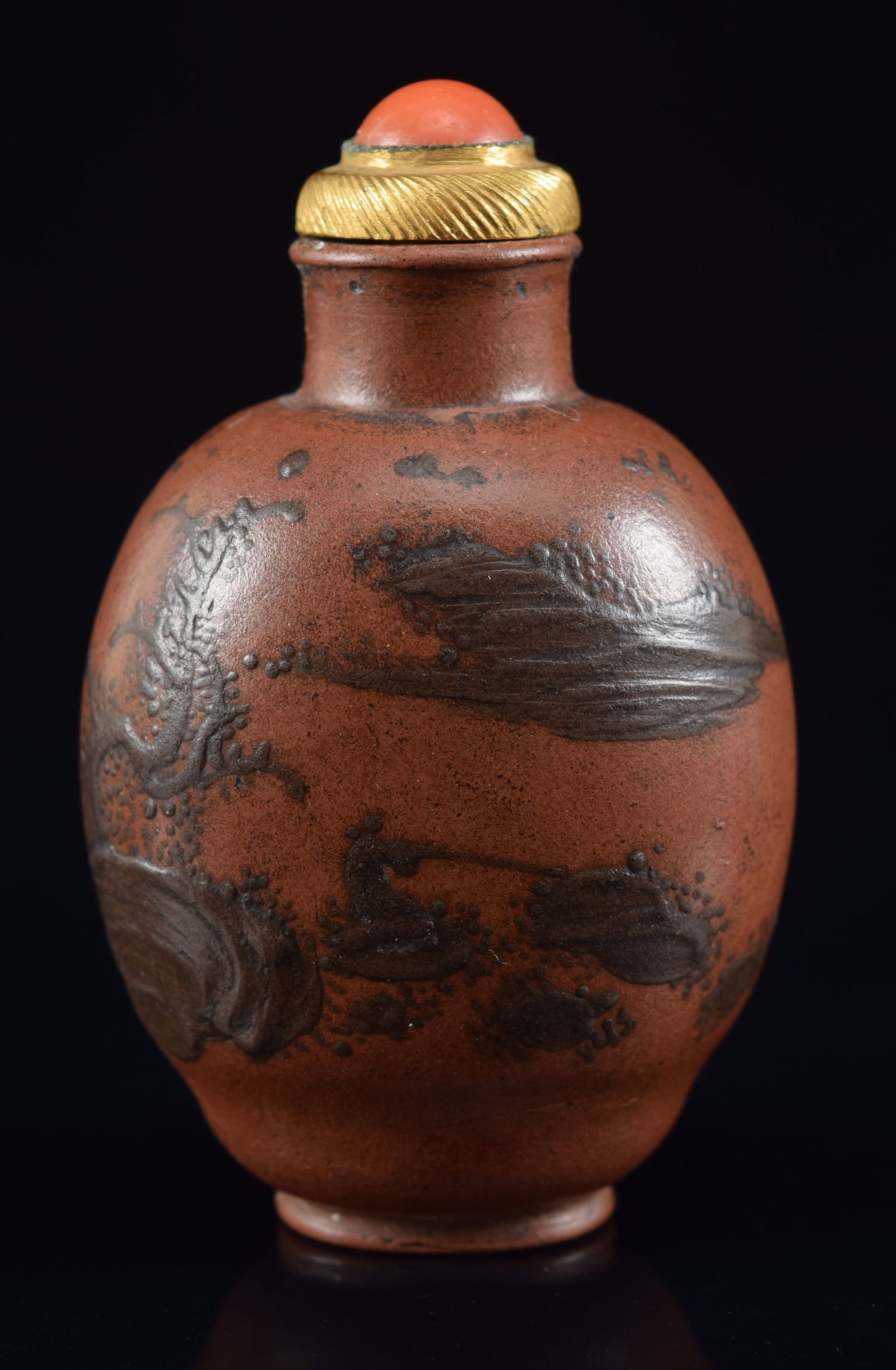 Yi Hsing snuff bottle. China. 19th century. Slip decorated with a landscape. Coral and gilt metal (1 of 6)