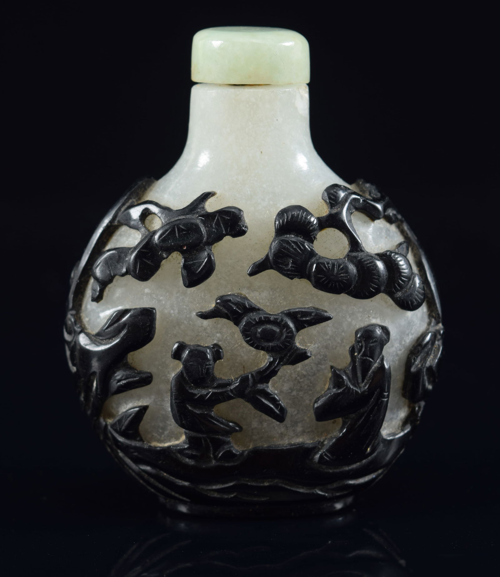 Cameo glass snuff bottle. China. 19th century. Black cut to snowflake. Decoration of scholars in a: Cameo glass snuff bottle. China. 19th century. Black cut to snowflake. Decoration of scholars in a landscape. 2.5in H. Provenance: The Mitchell Bistany Collection.