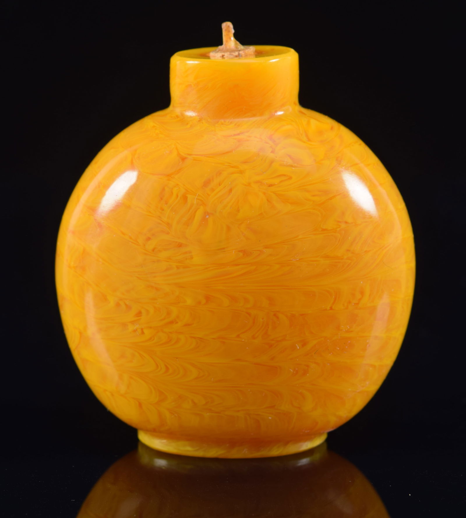 Peking glass snuff bottle. China. 19th century. Swirling amber color. 2.75in H. Provenance: The (1 of 6)
