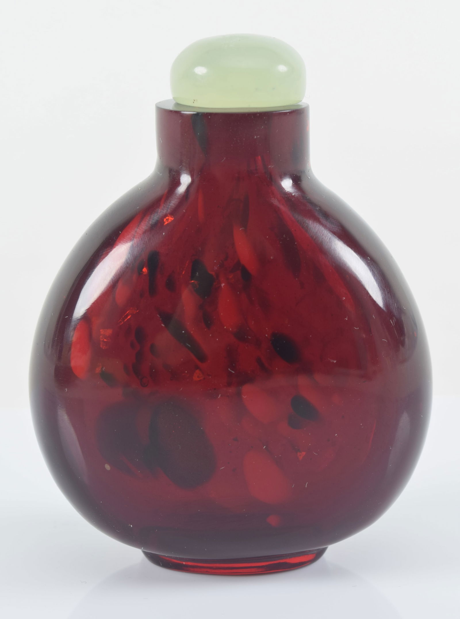 Peking glass snuff bottle. China. 19th century. Ruby red with gold streaks. 2.5in H. Provenance: The (1 of 7)
