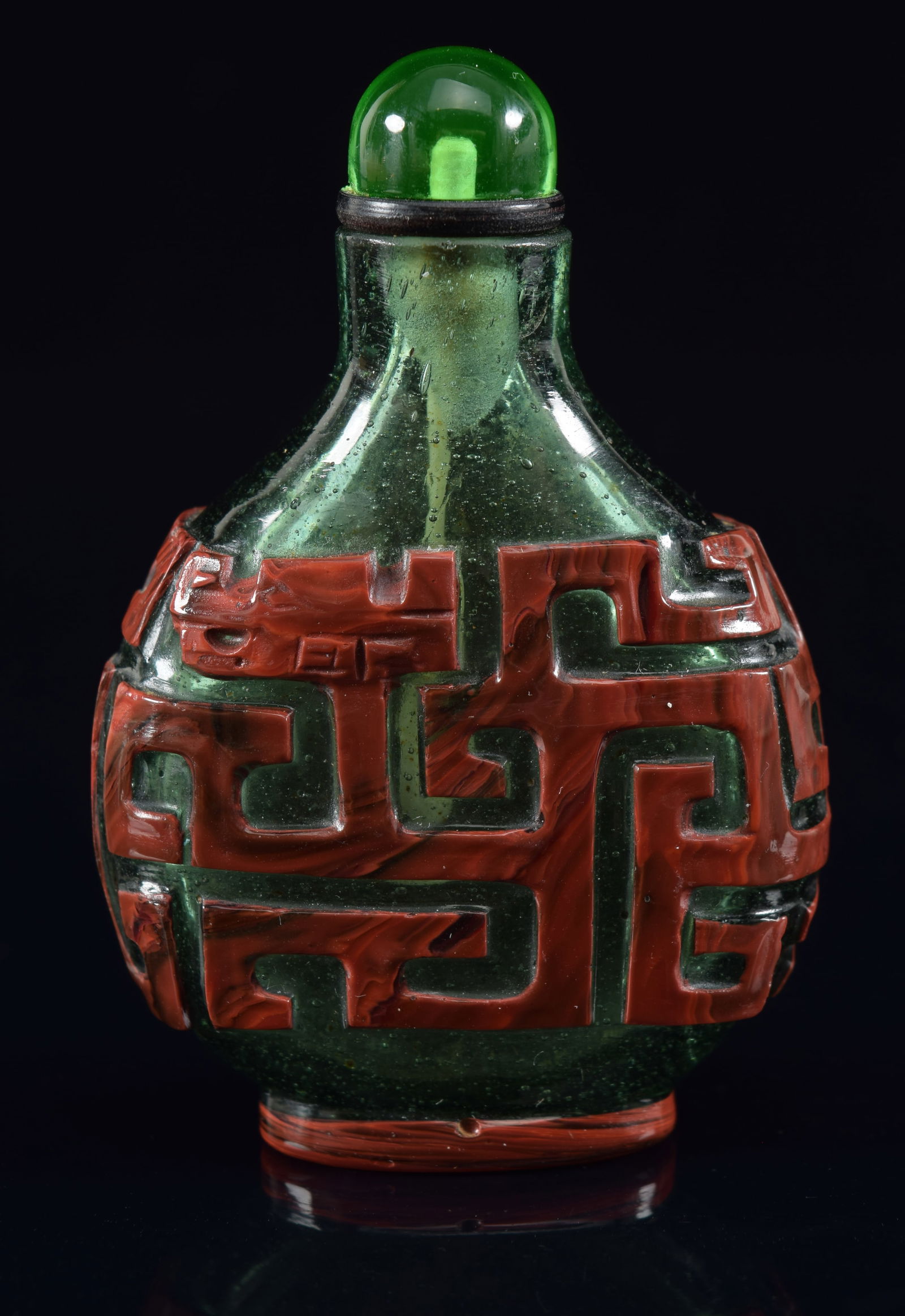 Cameo glass snuff bottle. China. 19th century. Red cut to green with archaic scrolling. 2.25in H. (1 of 6)