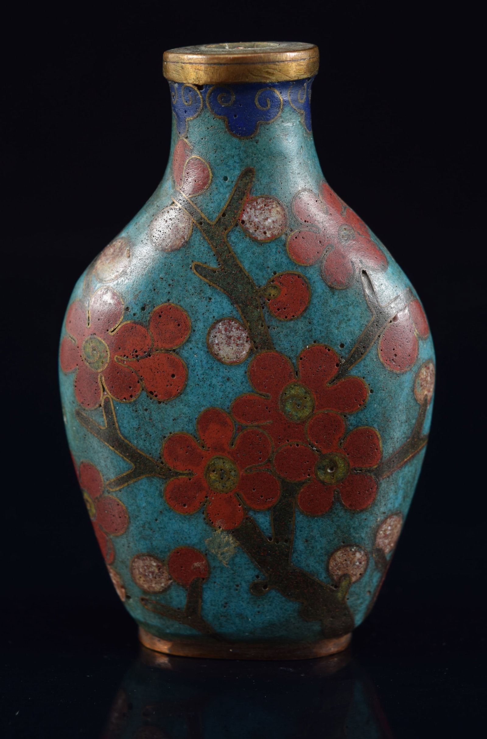 Cloisonne snuff bottle. China. 19th century. Decoration of a flowering tree on a dark turquoise: Cloisonne snuff bottle. China. 19th century. Decoration of a flowering tree on a dark turquoise ground. 2.75in H. Provenance: The Mitchell Bistany Collection.
