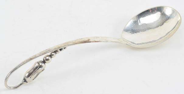 E. Dragsted Danish modern sterling silver serving spoon. Bell flower and graduated sphere design on: E. Dragsted Danish modern sterling silver serving spoon. Bell flower and graduated sphere design on handle. Hand hammered finish. Marked underside. 9.5in length. 3.1 ozt.