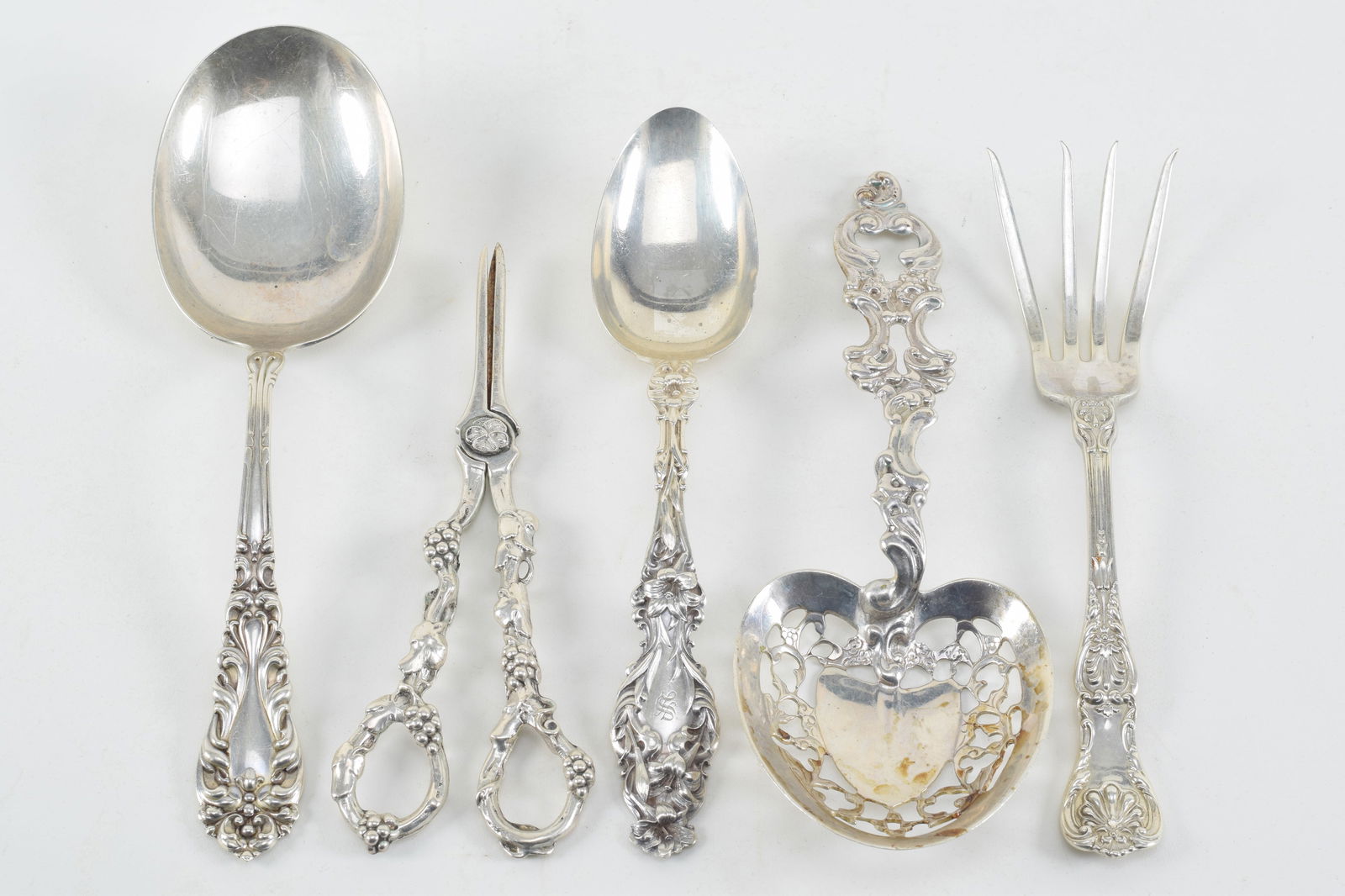 5 sterling silver serving pieces. 1) Gorham serving spoon with lily decorated handle. 2) Whiting ser (1 of 8)