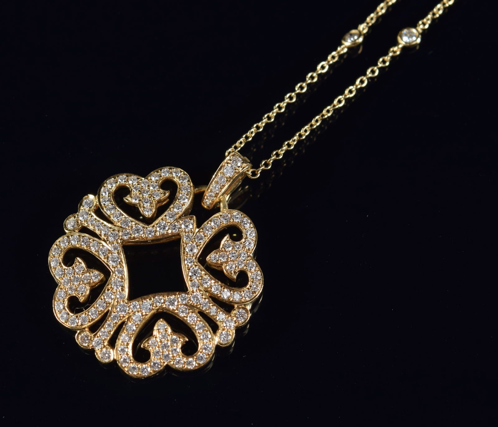Signed 18K gold diamond pave openwork pendant necklace. Pendant with openwork heart design. Signed (1 of 6)
