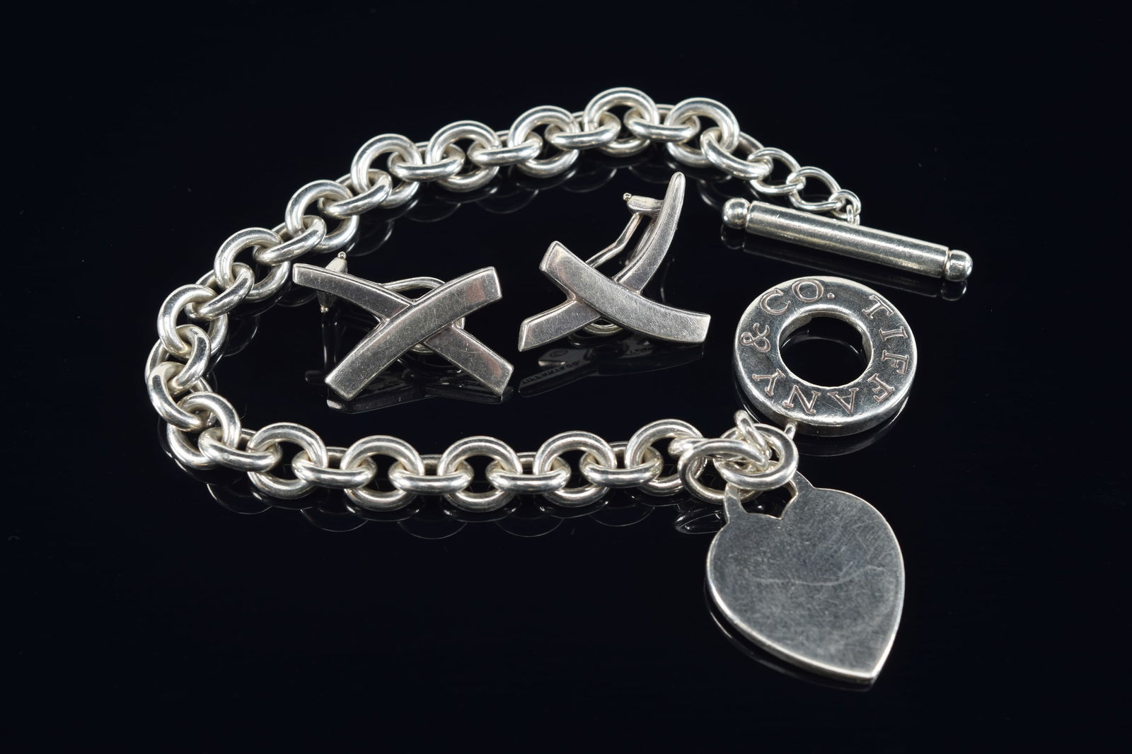 Tiffany & Co. sterling silver heart charm bracelet and Paloma Picasso for Tiffany & Co. Each marked. (1 of 5)