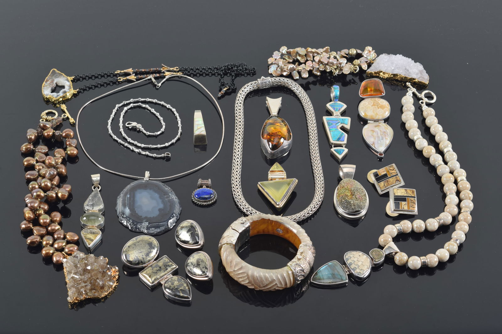 Lot of sterling silver and polished stone jewelry. To include: turquoise, coral, and mother of pearl (1 of 6)