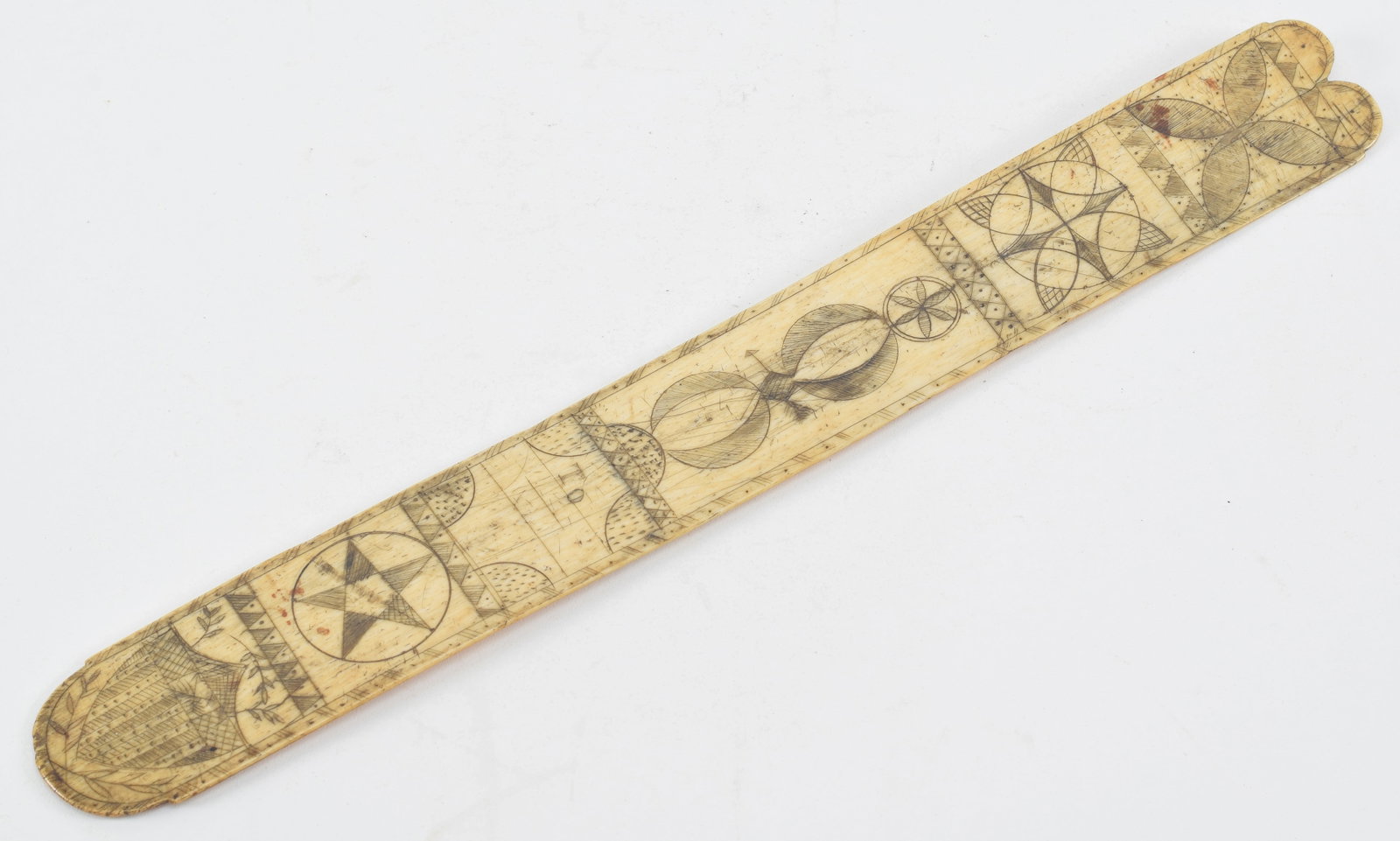 Sailor made carved bone and scrimshaw decorated busk with patriotic shield, 19th century. 13.5 x: Sailor made carved bone and scrimshaw decorated busk with patriotic shield, 19th century. 13.5 x 1.75 in