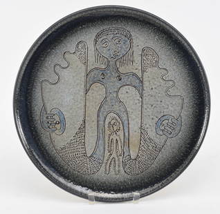 Edwin and Mary Scheier pottery charger with poly chrome glaze and incised figures. Incised mark on: Edwin and Mary Scheier pottery charger with poly chrome glaze and incised figures. Incised mark on back. Diameter 15.5 Repaired chip at edge.