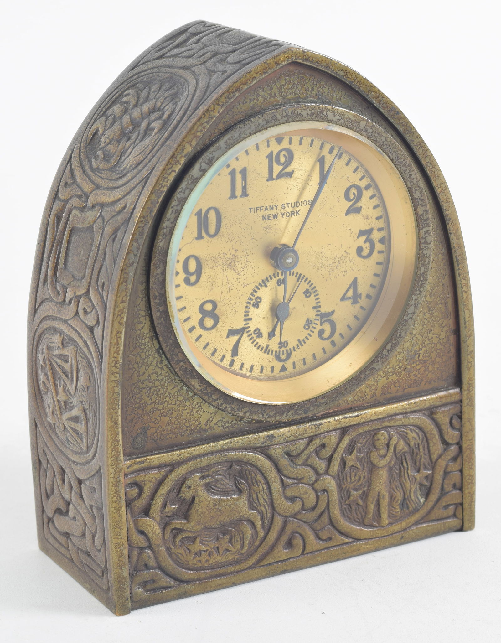 Tiffany Studios bronze desk clock, Zodiac pattern. Original bronze patination. Marked on base, (1 of 7)