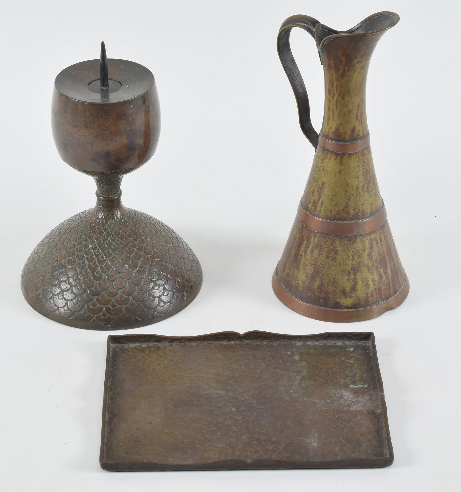 Collection of metalware, an Arts and crafts bronze pen tray, a peacock feather candlestick and a (1 of 6)