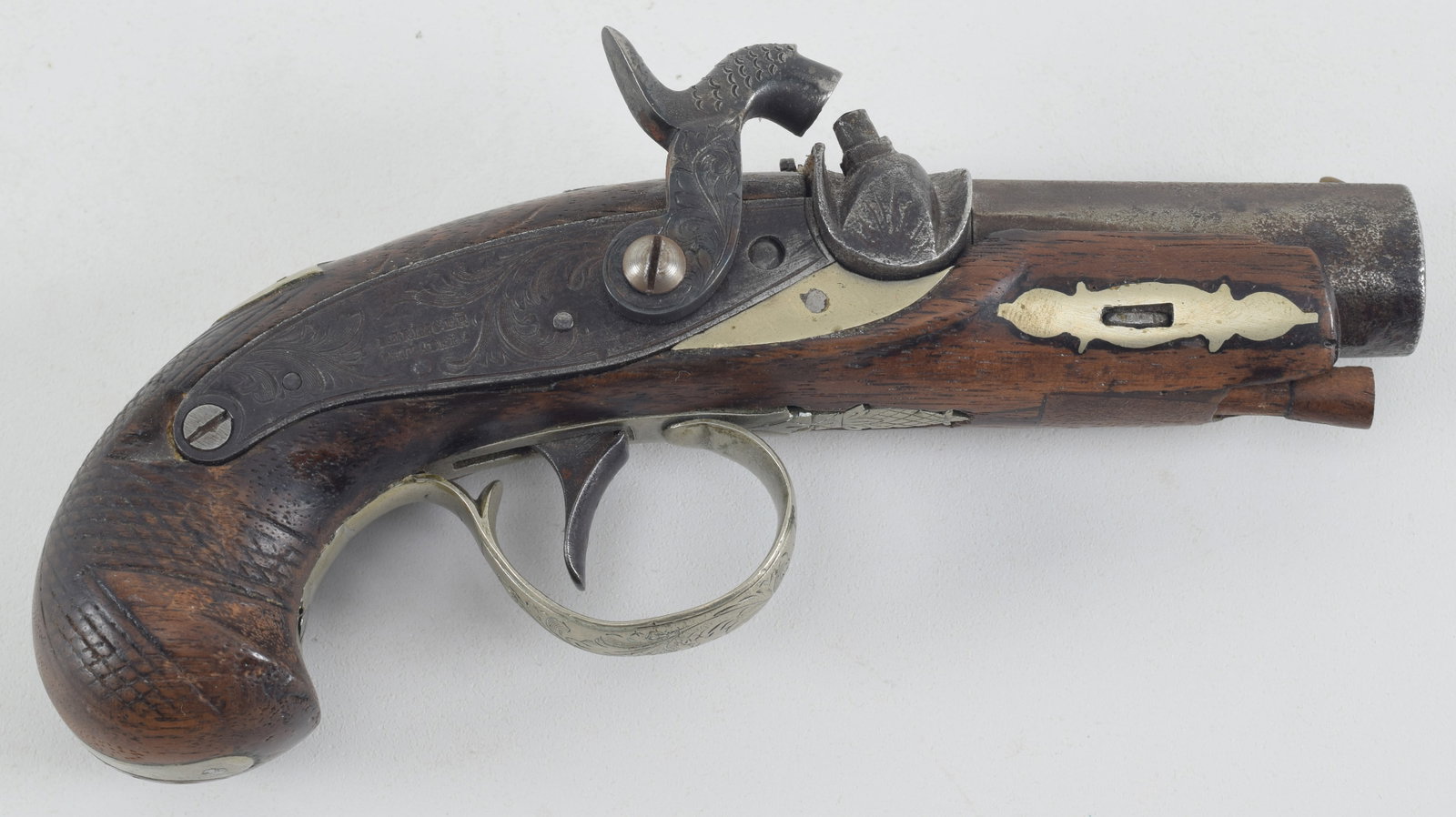 Small Pocket Percussion Derringer Pistol with German Silver mounts. Having a 2-3/4" Derringer: Small Pocket Percussion Derringer Pistol with German Silver mounts. Having a 2-3/4" Derringer stamped BBL being approx .40 Cal. Checkered grips with a 3/4" x 1/2" wood repair at ramrod entry. Trigger 