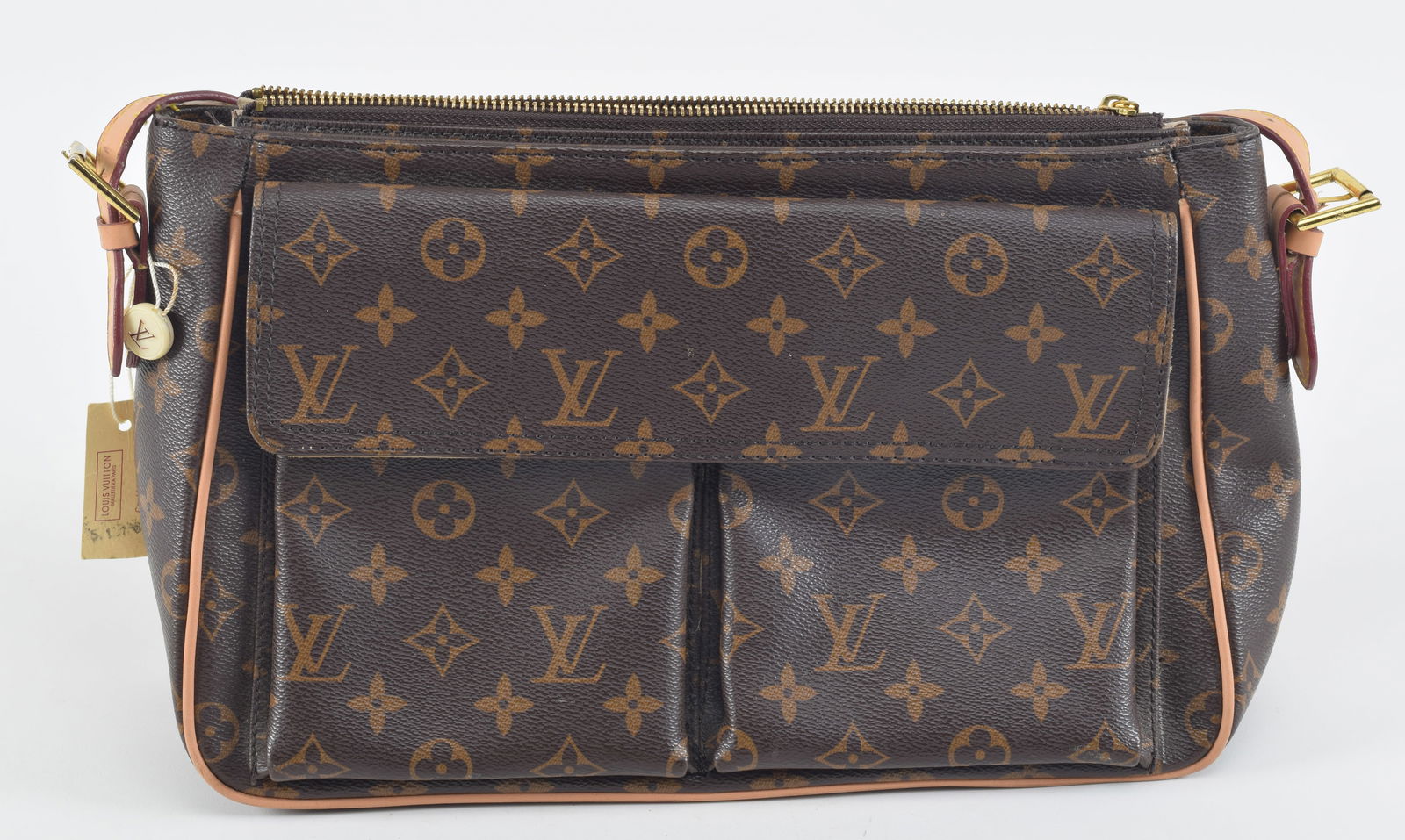 Original vintage Louis Vuitton pocketbook. Original Louis Vuitton label and button attached to (1 of 8)