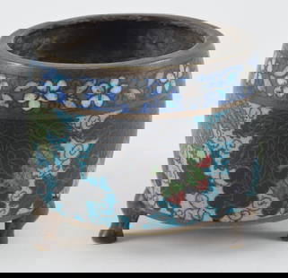 Unusual Chinese Ming period cloisonne footed bronze censer. Grape cluster and leaf decoration on a: Unusual Chinese Ming period cloisonne footed bronze censer. Grape cluster and leaf decoration on a blue ground. Mark on base. 3.75in H. Contusion on one side with some losses. Contusion around one foo