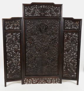 3 panel screen. China. 19th/early 20th century. Carved and pierced rosewood. Decoration of dragons,: 3 panel screen. China. 19th/early 20th century. Carved and pierced rosewood. Decoration of dragons, clouds, pearls and various auspicious emblems. Small cracks. 67in high. 61in wide.