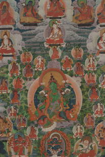 Buddhist icon. Tibet. 18th century. Thangka image of the green Tara surrounded by lineage figures.: Buddhist icon. Tibet. 18th century. Thangka image of the green Tara surrounded by lineage figures. 24 x 18in. Framed and glazed.