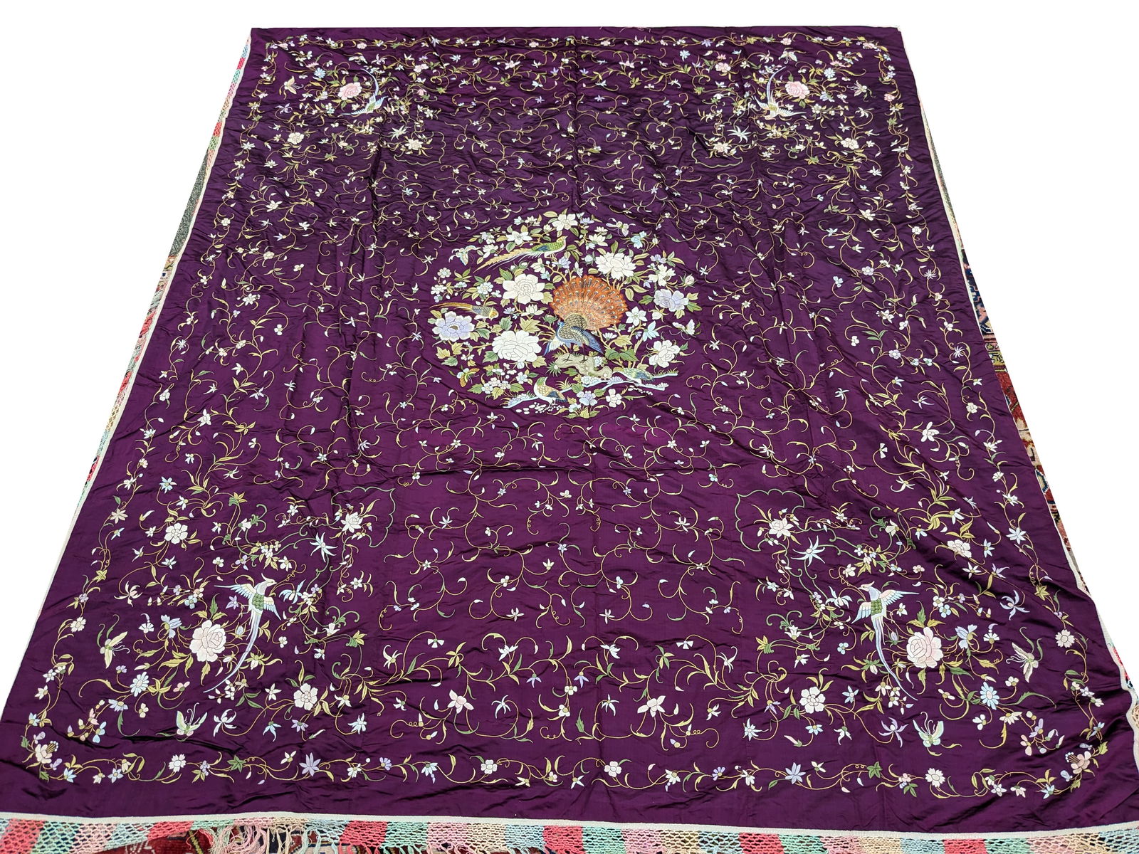 Textile panel. China. 19th century. Birds and flowers on purple ground. Fringe. Approx. 160 x 100in. (1 of 4)