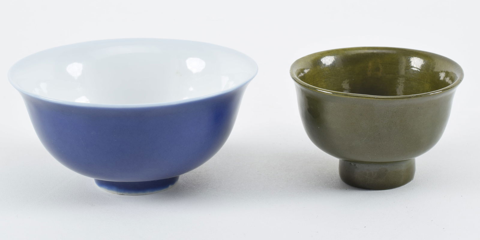2 porcelain bowls. China. 20th century. One cobalt, one dark celadon. Largest 4.5in diameter.: 2 porcelain bowls. China. 20th century. One cobalt, one dark celadon. Largest 4.5in diameter.
