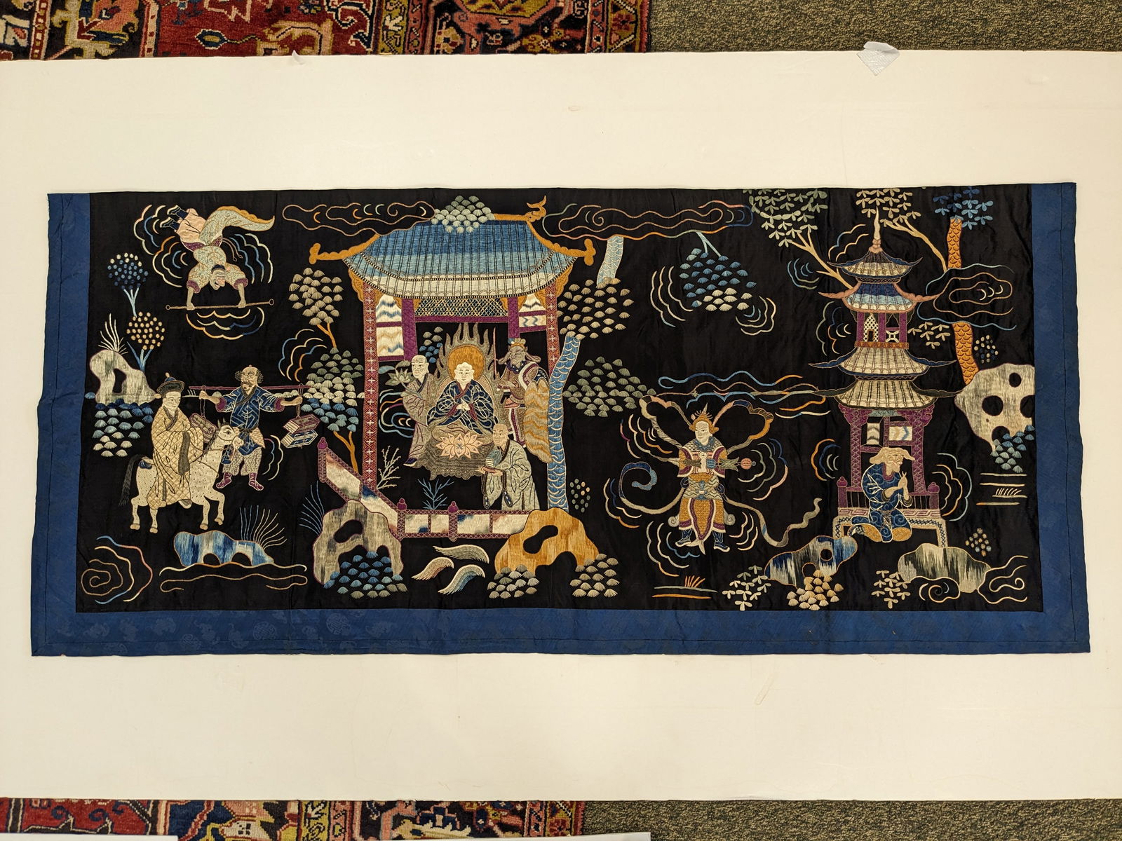 Textile panel. China. Early 20th century. Embroidery of scenes from "journey to the west". Black (1 of 5)