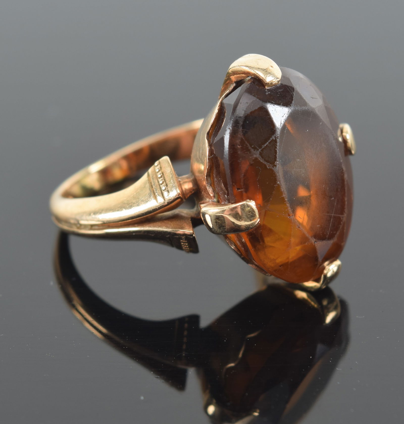 18K gold oval citrine mounted ring. Wear to stone. Approximate ring size 7.25. (1 of 6)