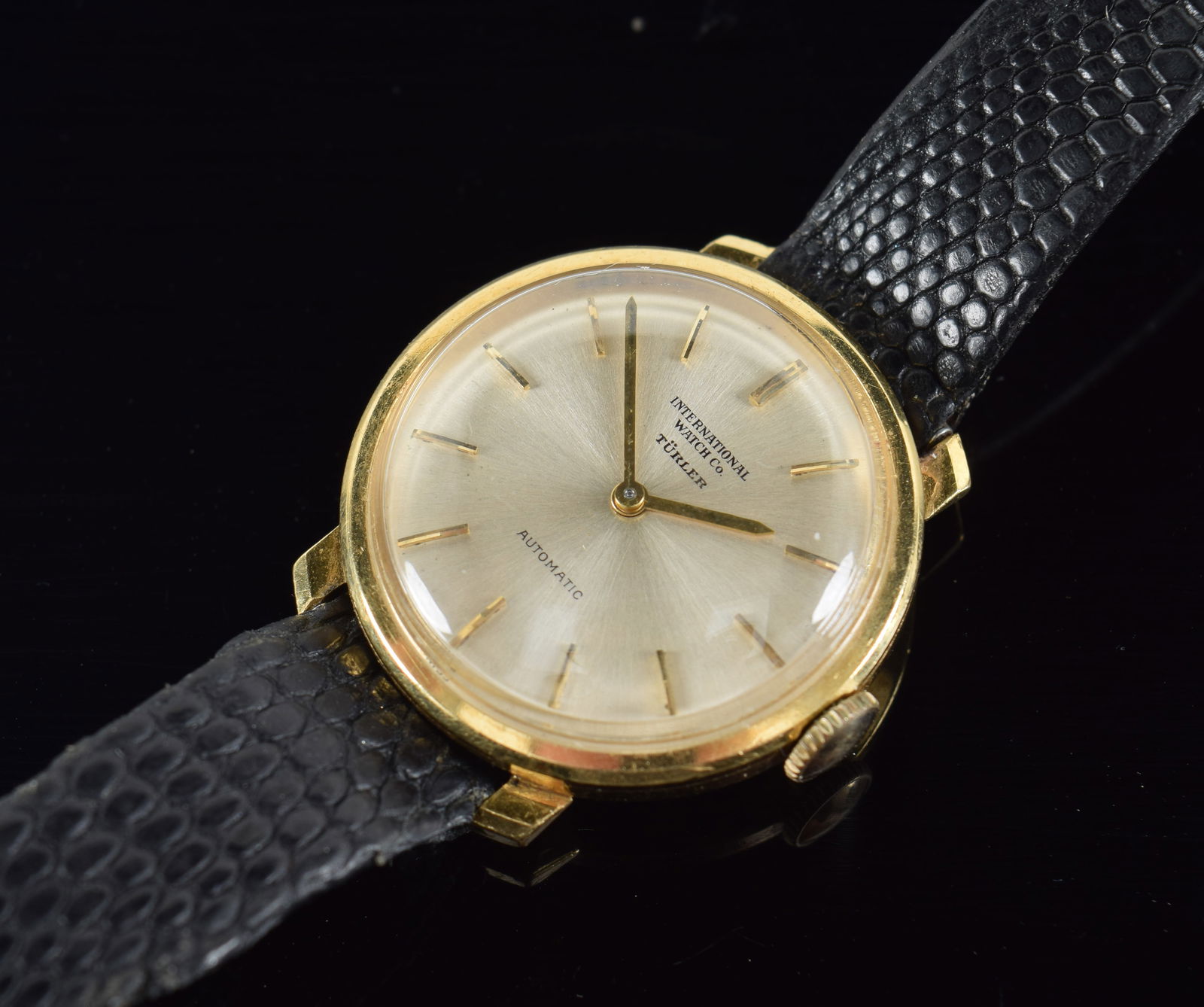 Gold International Watch Co. wristwatch. Turlor automatic. 0.9in diameter. Cannot open. (1 of 3)
