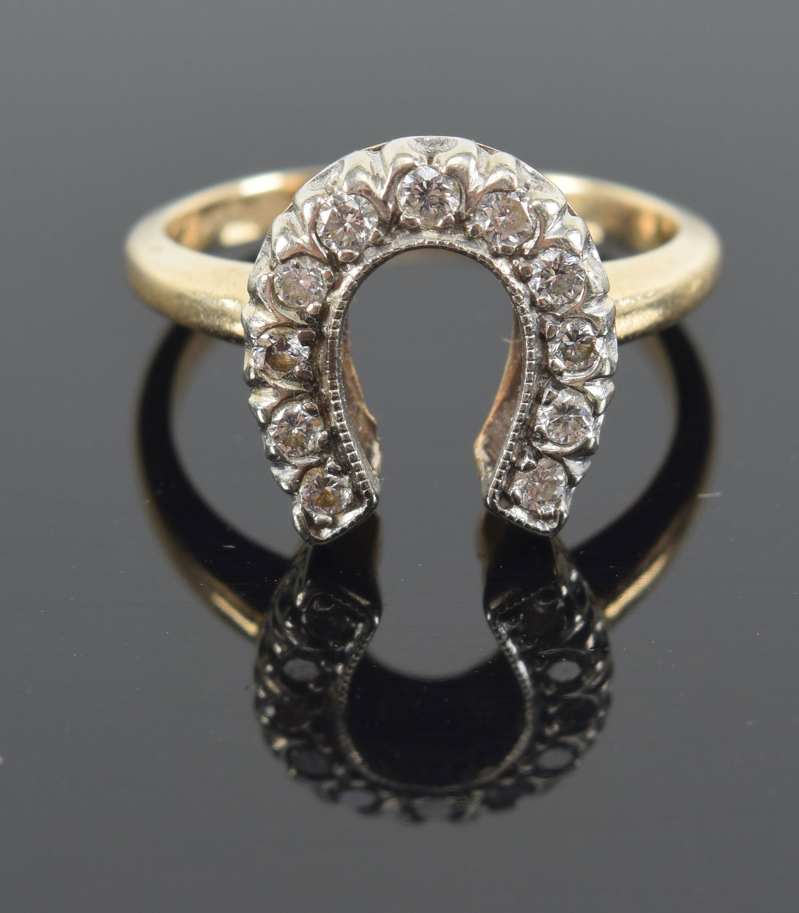 14K diamond mounted horseshoe gold ring. Approximate ring size 5. Marked 14K. 3.8 grams. (1 of 6)