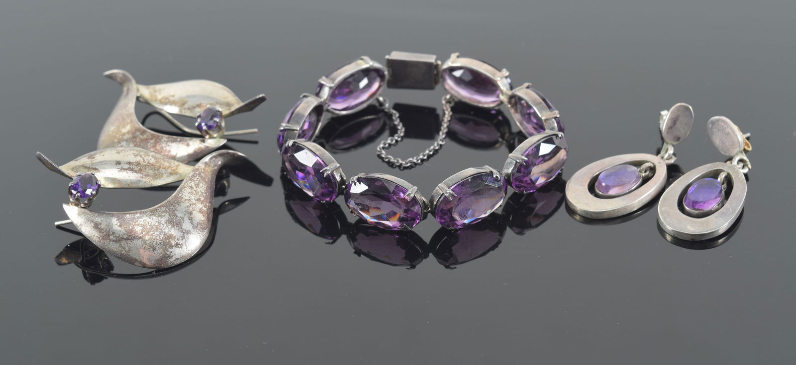 5 piece sterling silver lot of jewelry. 1) Pair of Mexico earrings. Oval form. 2) Pair of signed (1 of 6)