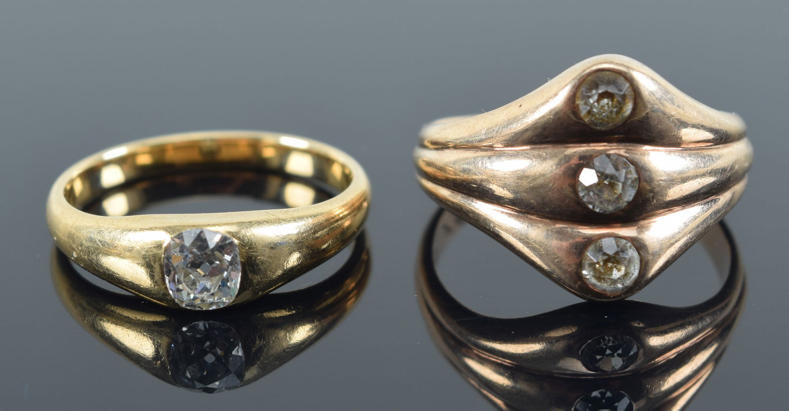 2 gold and diamond rings. One set with 3 stones. (1 of 5)