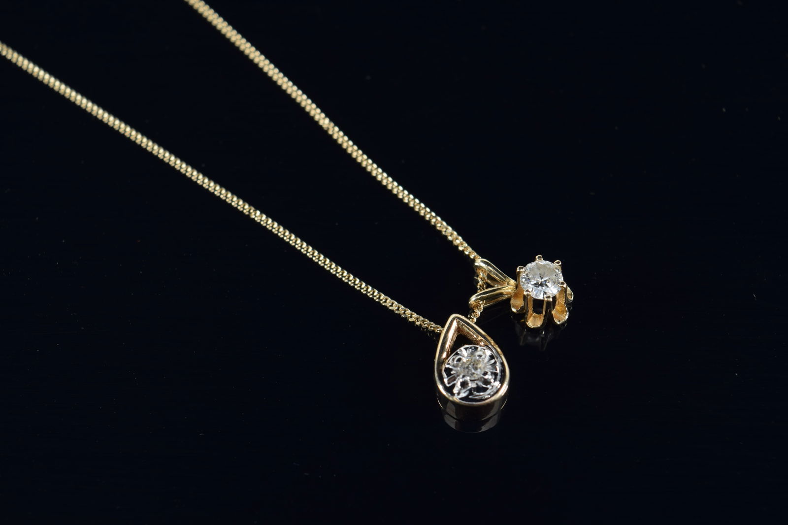 10K gold diamond pendants. 2 pendants on 1 10K chain. 18in length. 1.9 grams. (1 of 4)