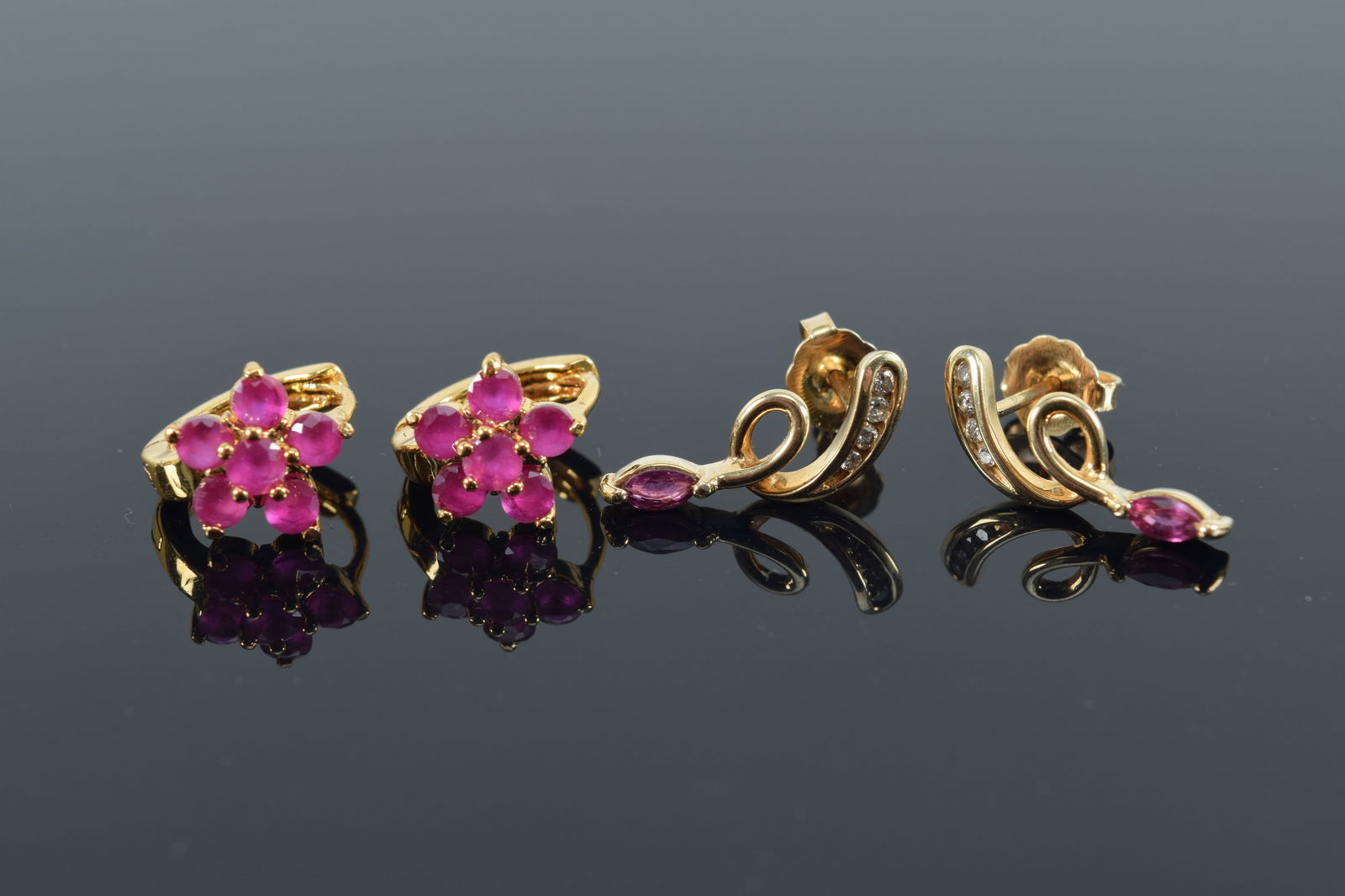 2 pairs of 14K gold ruby earrings. 1 flower form; the other with tiny diamonds. 4 grams total (1 of 3)