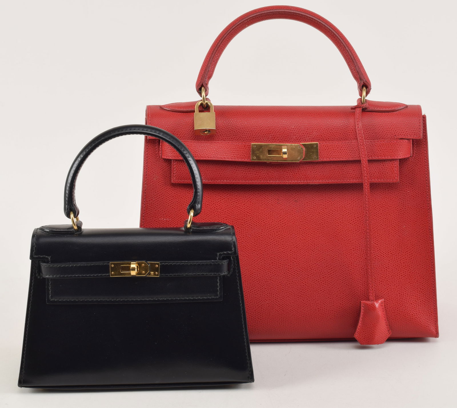 2 handbags after Hermes Kelly type. Larger red lizard skin style marked Lederer. Smaller black bag (1 of 6)