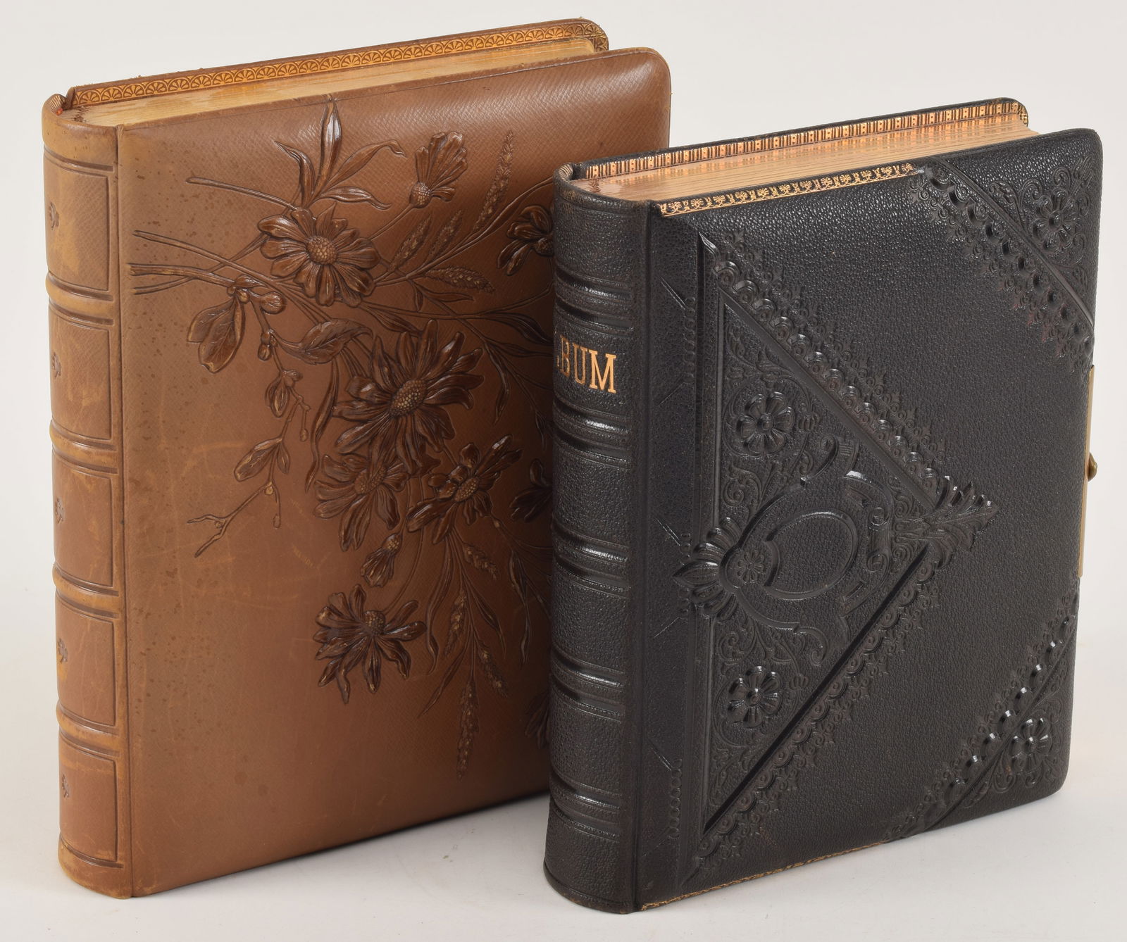 2 Victorian embossed leather photo albums with photographs. Each album completely full with cabinet (1 of 11)