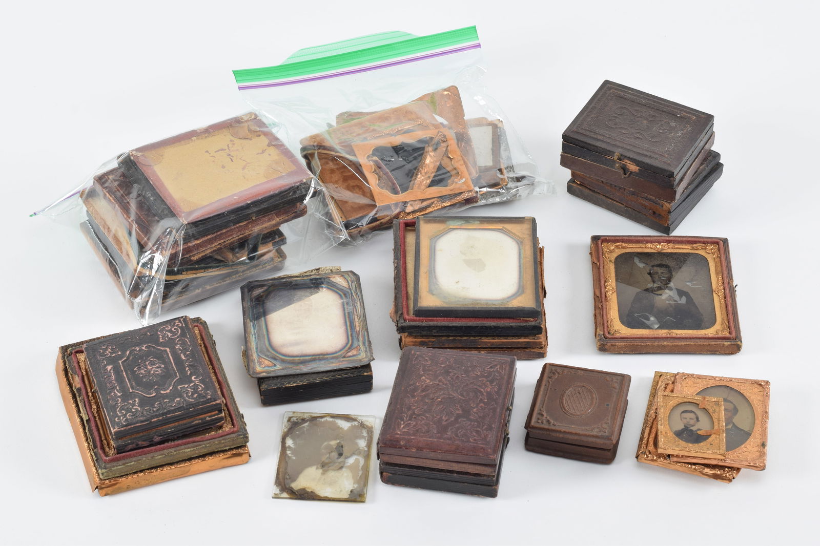 Lot of ambrotypes and daguerreotypes. 21 total images, including mother and baby, men, women, young (1 of 9)