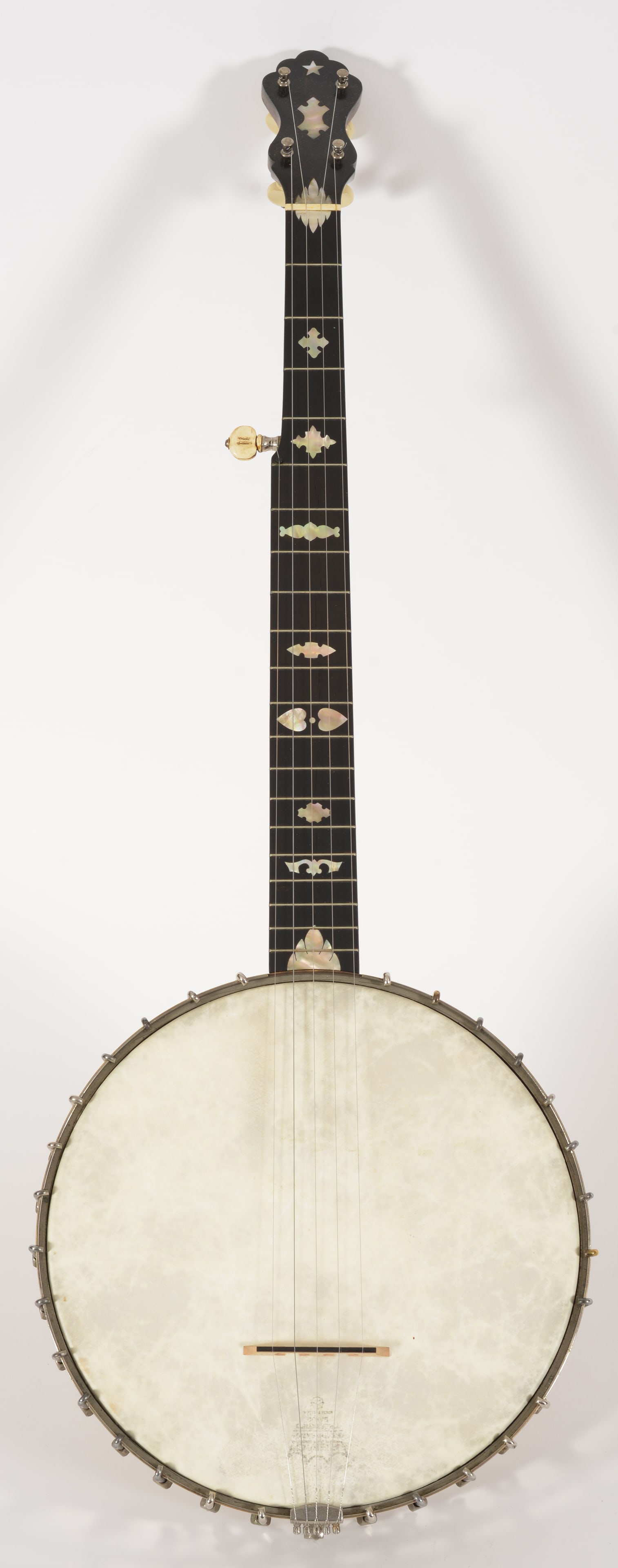 Lyon & Healy "Mystic" Banjo, circa 1890. Typical shell inlay on 20 fret fingerboard, 30 tension: Lyon & Healy "Mystic" Banjo, circa 1890. Typical shell inlay on 20 fret fingerboard, 30 tension hooks (lacking one set) on full spun nickel-plated rim. "Mystic" nameplate on dowel stick. No knot tailp