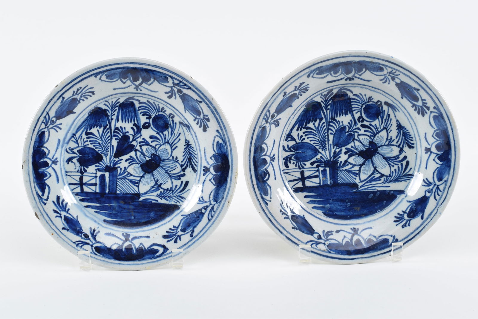 Pair of 18th Century Dutch delft blue and white decorated plates. Floral garden motif. Diameters 9 (1 of 7)