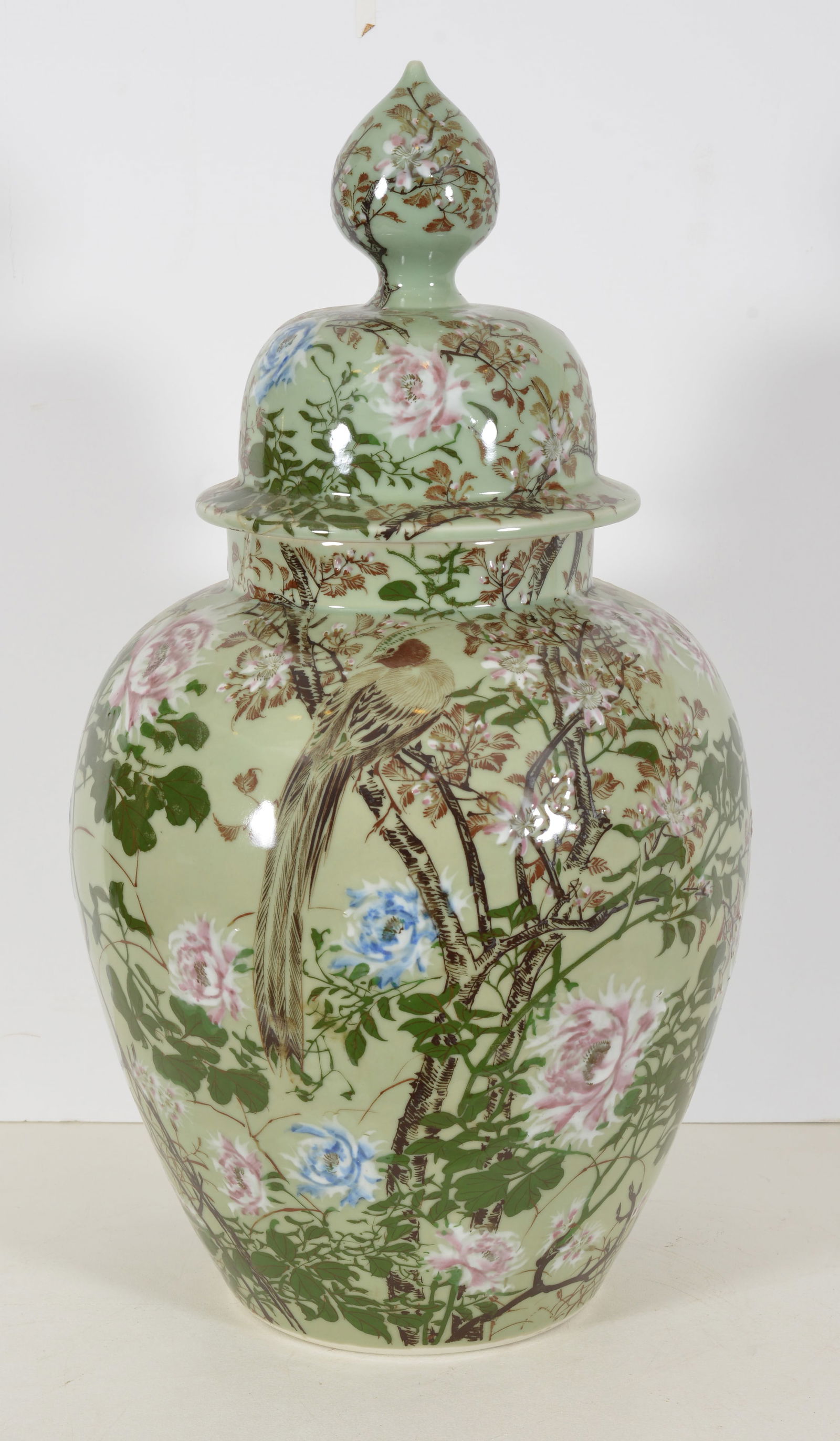 Large covered jar. Japan. 19th century. Arita ware. Celadon ground with enameled flowers and (1 of 4)