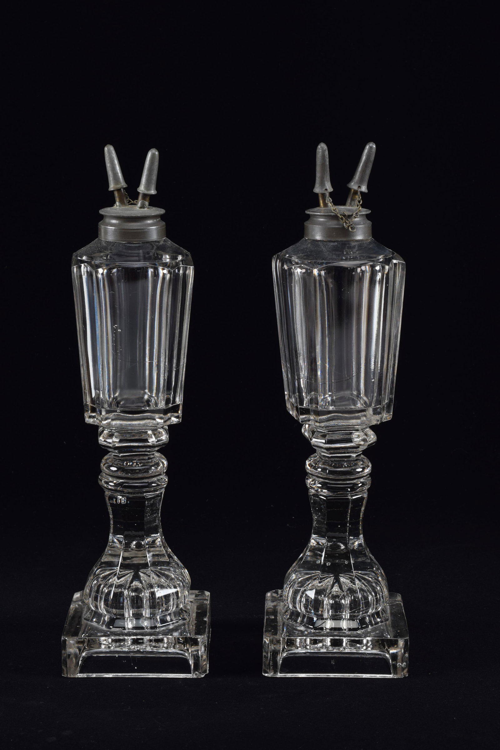 Pair of whale oil lamps, with faceted tops on square and pressed bases, 19th Century. Height 12.5in: Pair of whale oil lamps, with faceted tops on square and pressed bases, 19th Century. Height 12.5in