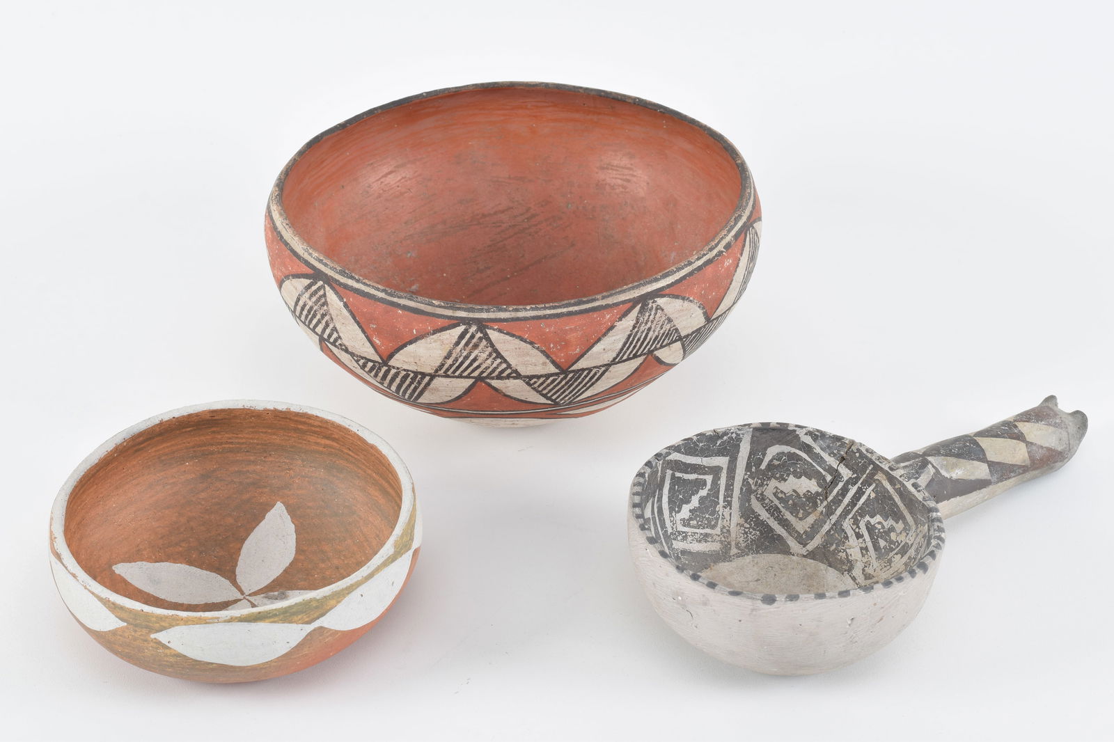 Early southwest Native American pottery pieces. 2 painted bowls and a handled scoop. Scoop with (1 of 12)