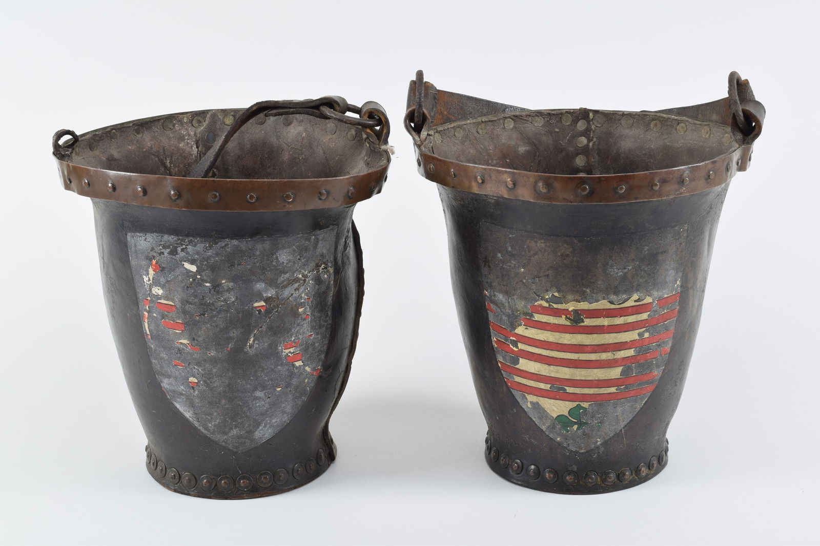 Pair of European leather fire buckets, 19th Century. Decorated with remnants of heraldic shields. (1 of 11)