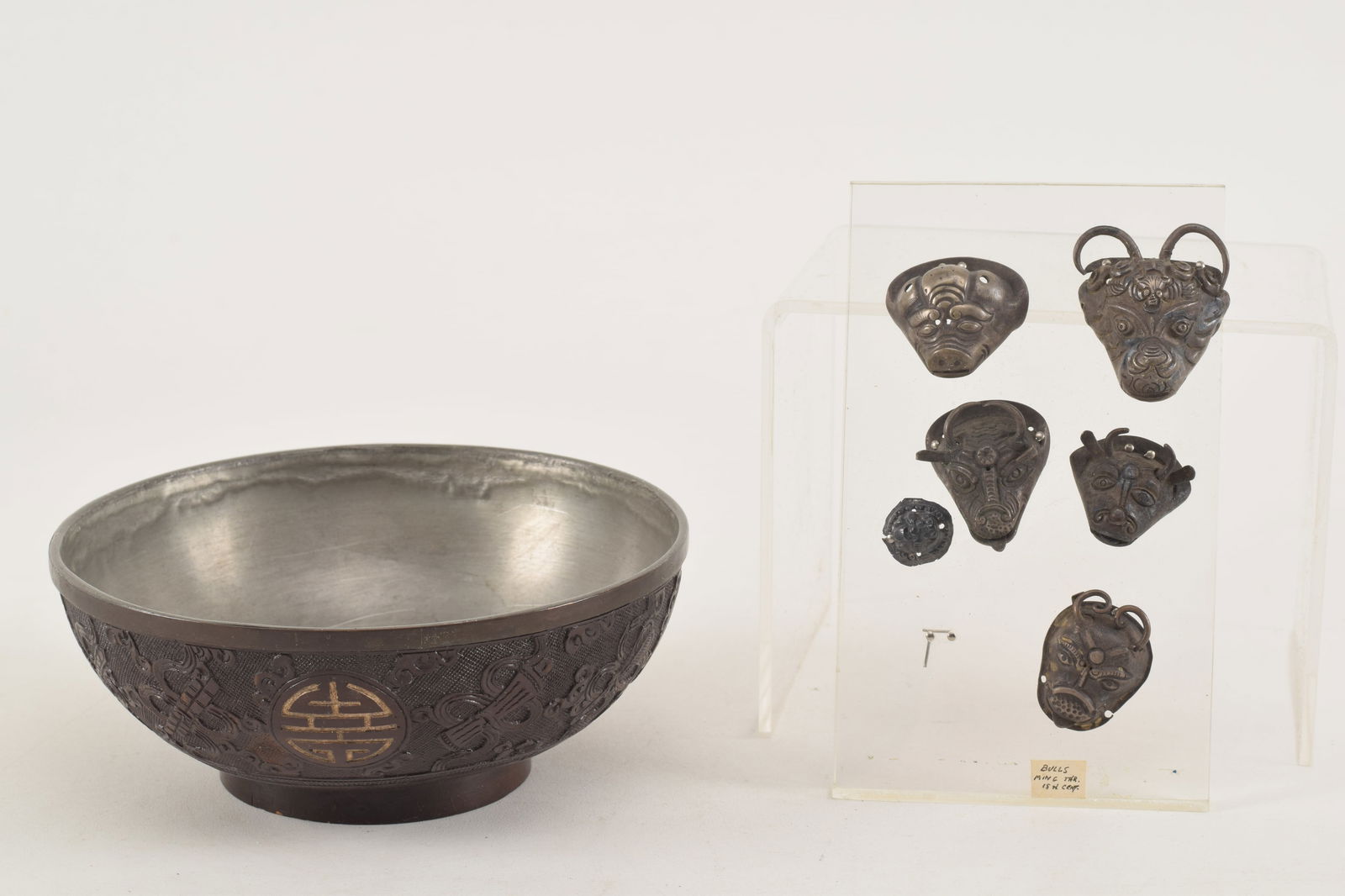 Lot of Chinese items. 6 antique Chinese silver bull masks. Largest 1.25in wide. Together with (1 of 6)