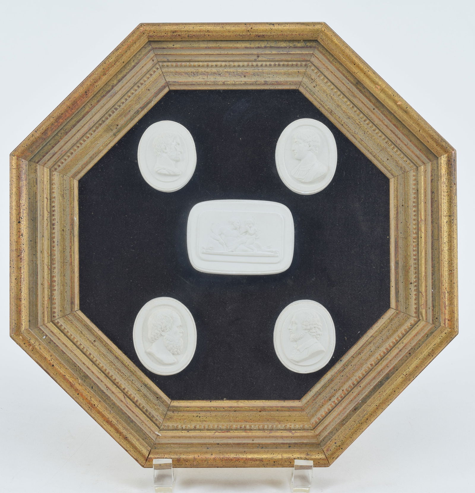 Classical plaster intaglio medallions. Includes 4 figural portraits, featuring Socrates and others, (1 of 3)